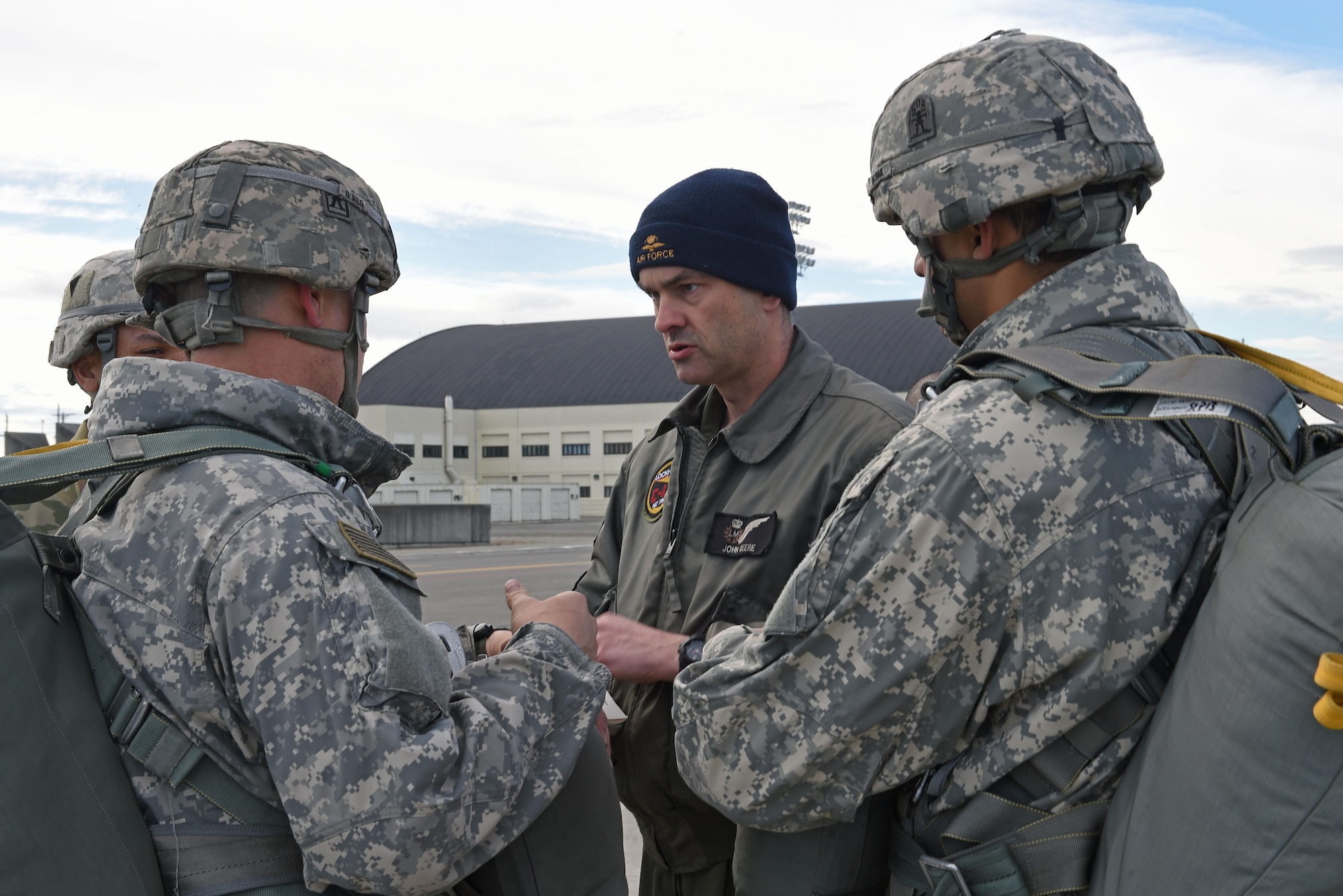 Flight Sgt. John Beere, with the Royal New Zealand Air Force’s No. 40 Squadron, briefs paratroopers assigned to the 4th Infantry Brigade Combat Team (Airborne), 25th Infantry Division, U.S. Army Alaska, prior to a jump during Red-Flag Alaska 17-1 at Joint Base Elmendorf-Richardson, Alaska, Oct. 12, 2016. Red Flag-Alaska exercises are focused on improving the combat readiness of U.S. and international forces and providing training for units preparing for Air Expeditionary Force taskings. 