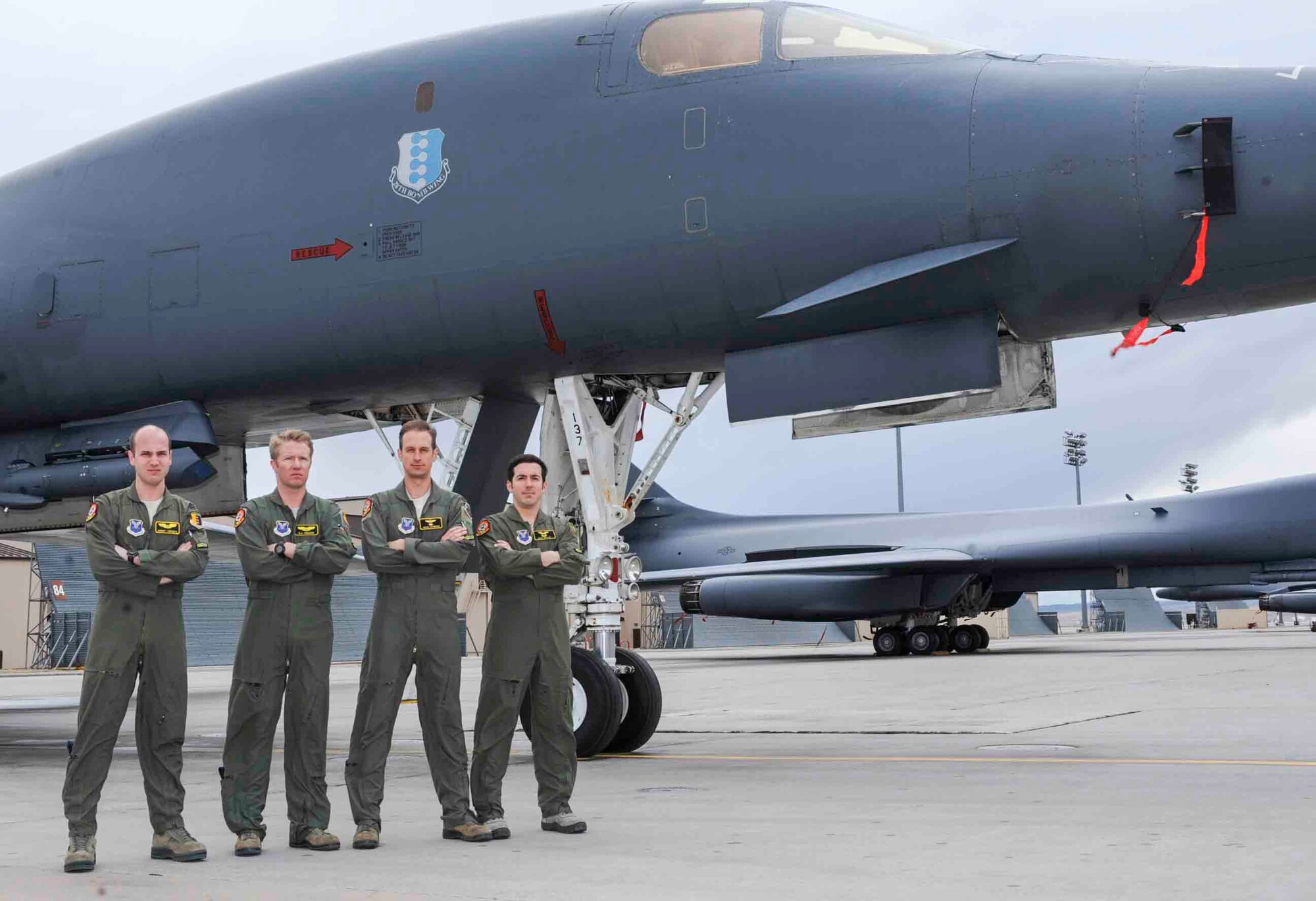 The 2015 General Curtis E. LeMay award winning aircrew from the 37th Bomb Squadron stand next to a B-1 Lancer at Ellsworth Air Force Base, S.D., March 7, 2016. Their success in a bombing mission during Operation Iron Resolve destroyed oil fields supplying income to Islamic State of Iraq and the Levant and won the award for the best bomber crew of 2015. (U.S. Air Force photo by Airman 1st Class Denise M. Jenson)