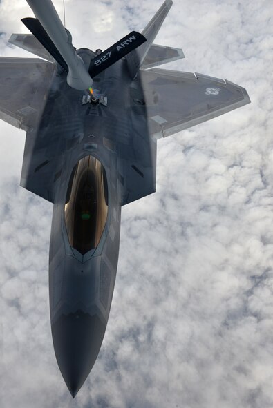 A U.S. Air Force F-22 Raptor multi-role fighter aircraft assigned to the 525th Fighter Squadron out of Joint Base Elmendorf-Richardson, Alaska, receives fuel from a KC-135 Stratotanker refueling aircraft assigned to the 927th Air Refueling Wing, MacDill Air Force Base, Fla., Aug. 16, 2016, in the Joint Pacific Alaska Range Complex during RED FLAG-Alaska 16-3. During air refueling a boom operator is responsible for making sure aircraft are refueled properly. (U.S. Air Force photo by Airman Isaac Johnson)

