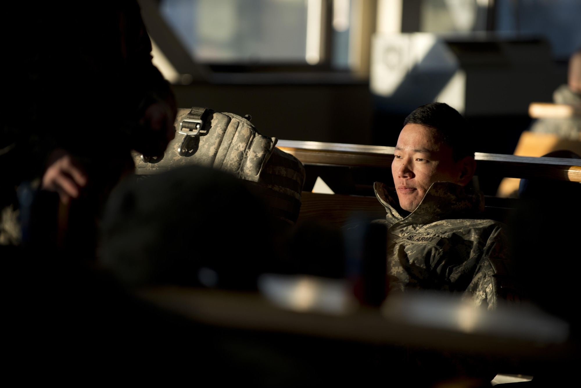 A paratrooper with the 4th Infantry Brigade Combat Team (Airborne), 25th Infantry Division, U.S. Army Alaska, waits in the Joint Mobility Complex to board an Air Force C-17 Globemaster III for a jump during Red-Flag Alaska 17-1 at Joint Base Elmendorf-Richardson, Alaska, Oct. 12, 2016. Red-Flag Alaska 17-1 provides joint offensive counter-air, interdiction, close air support, and large force employment training in a simulated combat environment. 