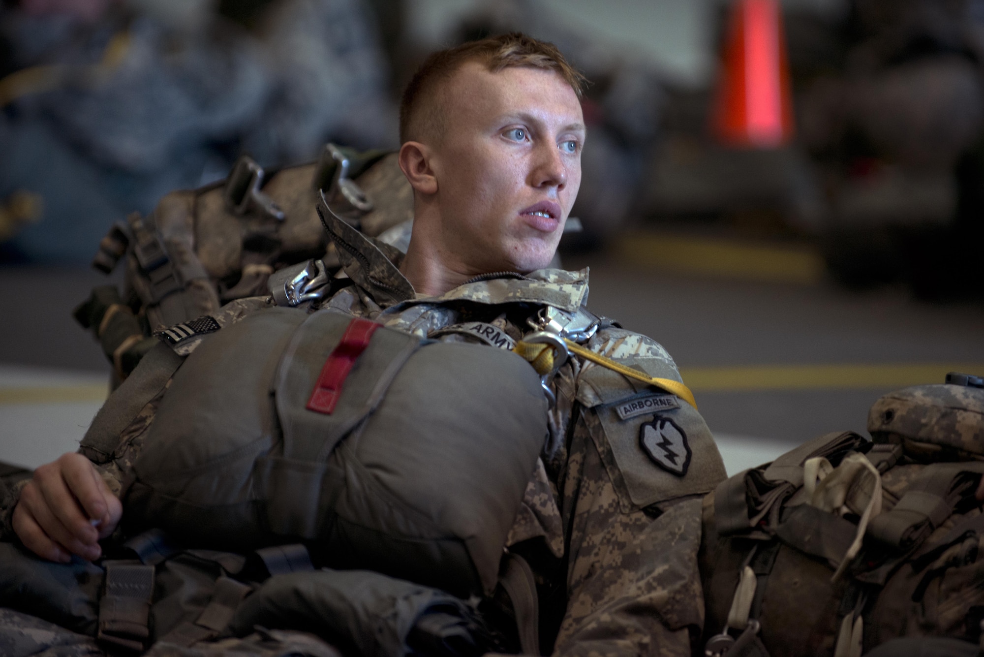 A paratrooper with the 4th Infantry Brigade Combat Team (Airborne), 25th Infantry Division, U.S. Army Alaska, waits to board a Royal New Zealand Air Force C-130 Hercules for a jump during Red-Flag Alaska 17-1 at Joint Base Elmendorf-Richardson, Alaska, Oct. 12, 2016. Red-Flag Alaska 17-1 provides joint offensive counter-air, interdiction, close air support, and large force employment training in a simulated combat environment. 