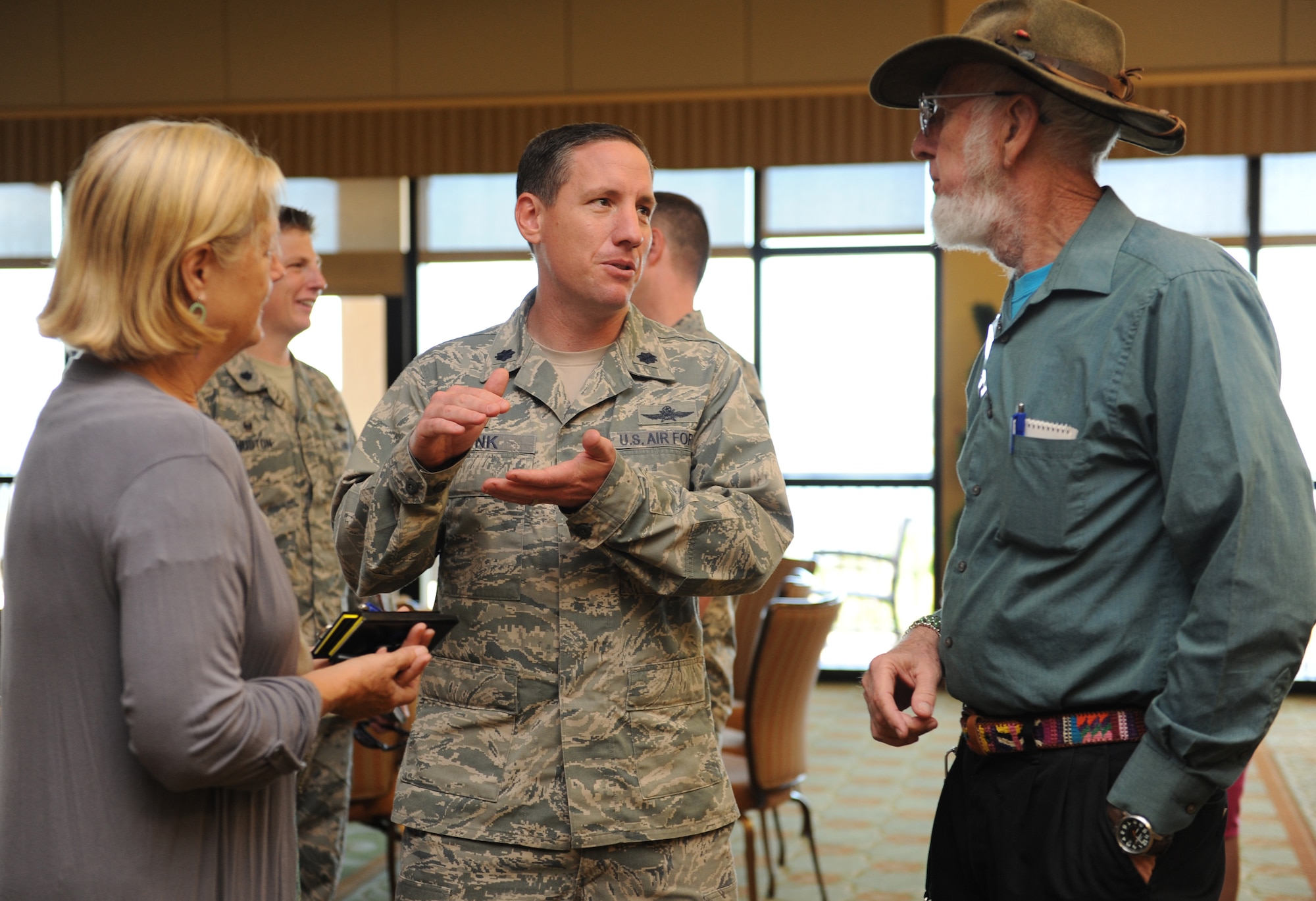 Lt. Col. Michael Zink, 338th Training Squadron commander, speaks with Diane Thompson and Louis Finkle, local business developers, during the quarterly Biloxi Chamber of Commerce Morning Call at the Bay Breeze Event Center Oct. 13, 2016, on Keesler Air Force Base, Miss. Local business and community leaders attended the event to learn more about the base’s mission and its Airmen. During the event, several 81st Training Group Airmen also shared their story about why they joined the Air Force. (U.S. Air Force photo by Kemberly Groue/Released)