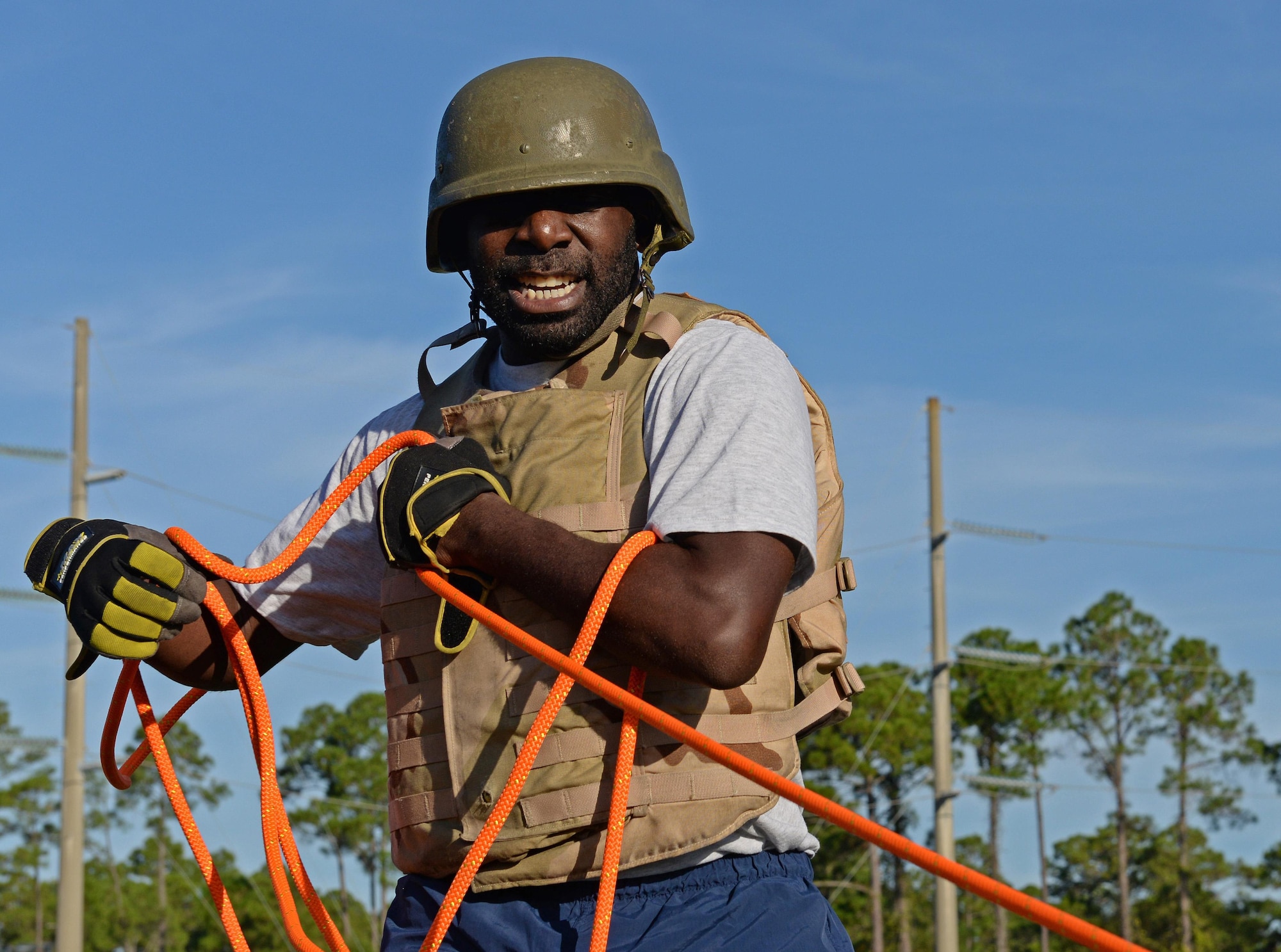 Tech. Sgt. Charles Ballard, a supply manager for the 1st Special Operations Logistics Readiness Squadron, pulls a sled with weights on it during the Fire Prevention Week fire muster challenge at Hurlburt Field, Fla., Oct. 14, 2016. The muster challenge was open to all squadrons on base and encouraged Airmen to see how firefighters train. (U.S. Air Force photo by Senior Airman Andrea Posey)