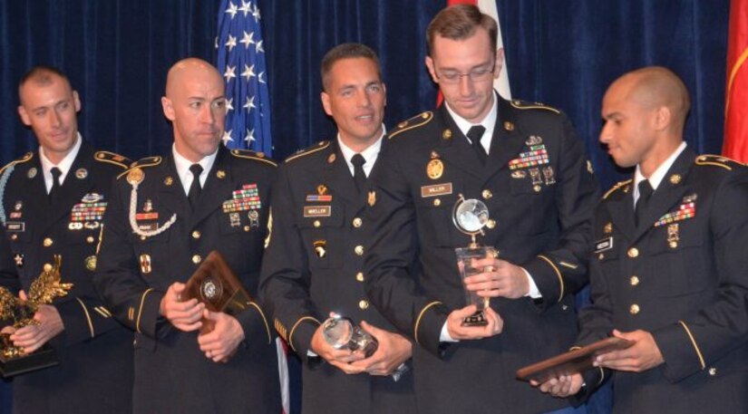 Runners-up and winners of the Best Warrior competition take the stage after being announced on Monday, Oct. 3, at the Association of the U.S. Army annual meeting in Washington, D.C. From left are Sgt. 1st Class Nicholas Bogert, representing TRADOC, who came in second place for Noncommissioned Officer of the Year; Sgt. First Class Iker Irmak, representing Army Medical Command, who came in third place for Noncommissioned Officer of the Year; Sgt. 1st Class Joshua A. Moeller, representing U.S. Army Reserve Command, who won Noncommissioned Officer of the Year; Spc. Robert Miller, representing U.S. Army Pacific Command, who won Soldier of the Year; and Sgt. Mitchell Keeton, representing Army Materiel Command, who came in third place for Soldier of the Year. Not pictured is Spc. Trey Castor, representing Army Special Operations Command, who came in second place for Soldier of the Year.