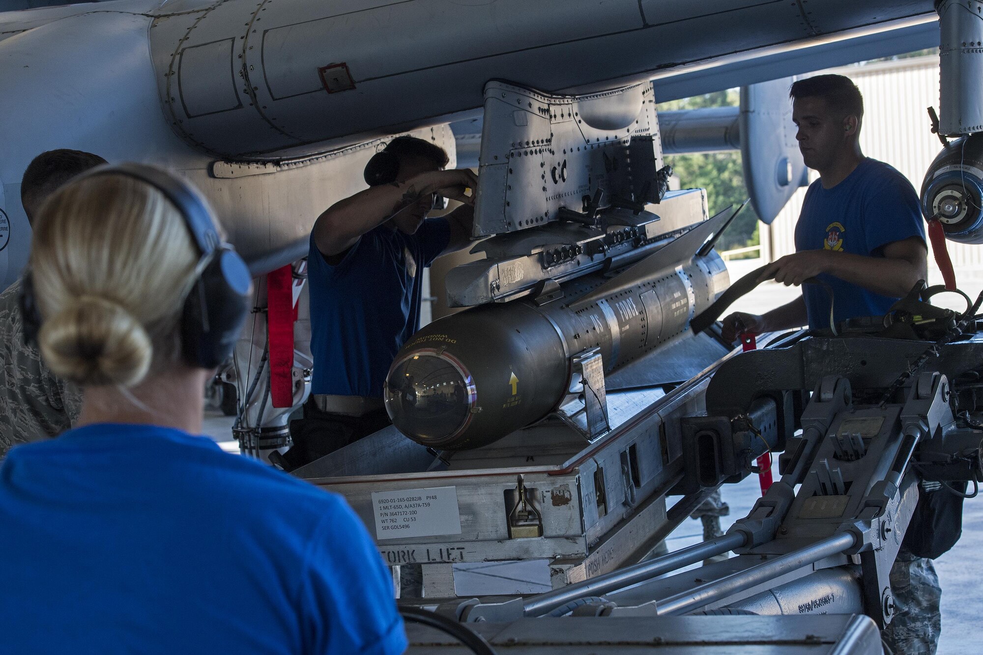 Airmen from the 74th Aircraft Maintenance Unit secure an inert AGM-65D missile to an A-10C Thunderbolt II during a weapons load competition, Oct. 14, 2016, at Moody Air Force Base, Ga. In addition to the quarterly competition, load crews are evaluated by weapons standardization every month to ensure they can safely and efficiently load weapons. (U.S. Air Force photo by Airman 1st Class Janiqua P. Robinson)