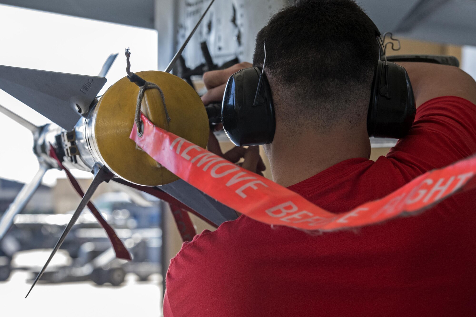 Airman 1st Class Tyler Wells, 75th Aircraft Maintenance Unit weapons load member, secures an inert AIM-9 air-to-air missile onto an A-10C Thunderbolt II during a weapons load competition, Oct. 14, 2016, at Moody Air Force Base, Ga. The competition is a way for load crews to stay determined, focused and keep the rivalry between the 74th and 75th AMU alive. (U.S. Air Force photo by Airman 1st Class Janiqua P. Robinson)