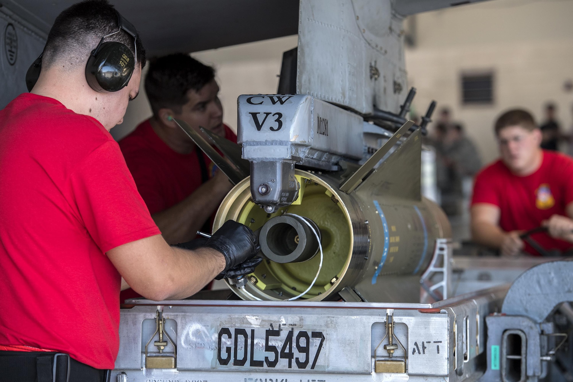 Airmen from the 75th Aircraft Maintenance Unit secure an inert AGM-65D missile to an A-10C Thunderbolt II during a weapons load competition, Oct. 14, 2016, at Moody Air Force Base, Ga. During the competition, the 74th and 75th AMUs sent their top teams to battle for bragging rights. (U.S. Air Force photo by Airman 1st Class Janiqua P. Robinson)