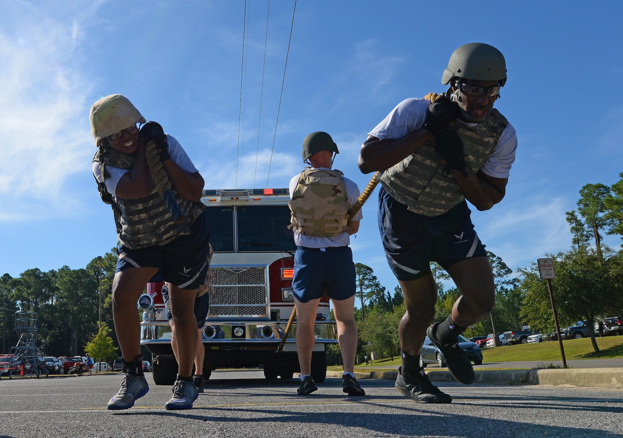 Air Commandos pull a fire truck during the Fire Prevention Week fire muster challenge at Hurlburt Field, Fla., Oct. 14, 2016. Teams competed in events such as the fire truck pull, a water hose joust and obstacle relays. (U.S. Air Force photo by Senior Airman Andrea Posey)