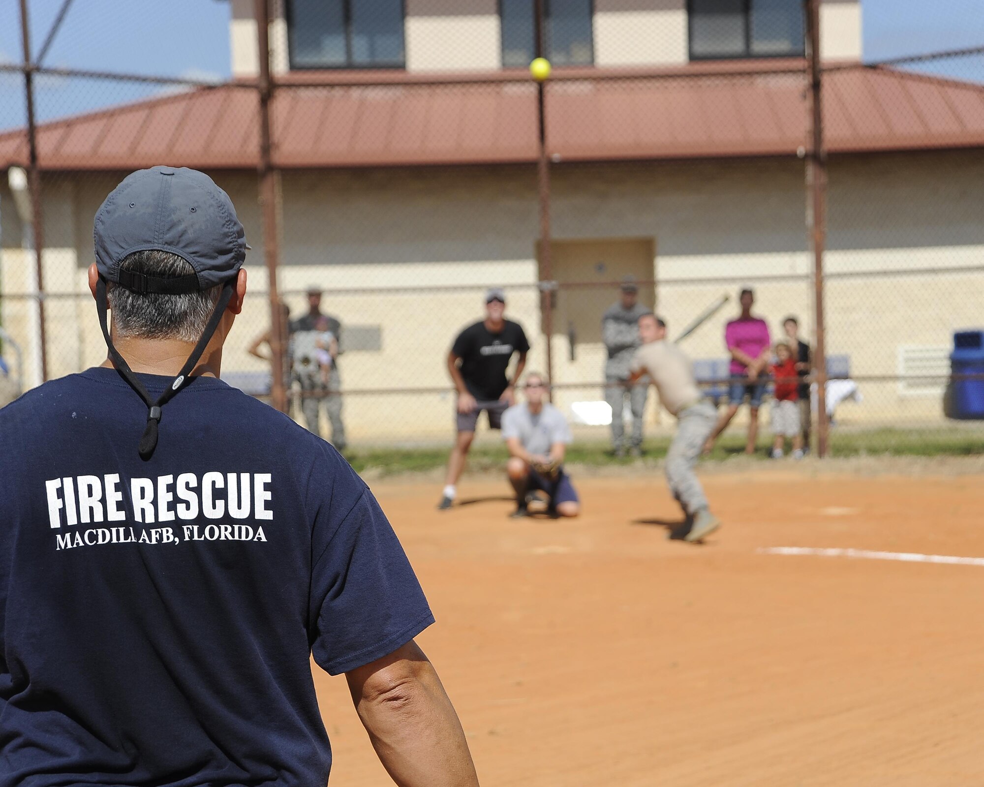 Firefighters assigned to the 6th Civil Engineer Squadron and members assigned to the 6th Security Forces Squadron play softball during Battle of the Badges at MacDill Air Force Base, Fla., Oct. 13, 2016. This was one of many events held in celebration of Fire Prevention Week at MacDill. (U.S. Air Force photo by Airman 1st Class Mariette Adams)