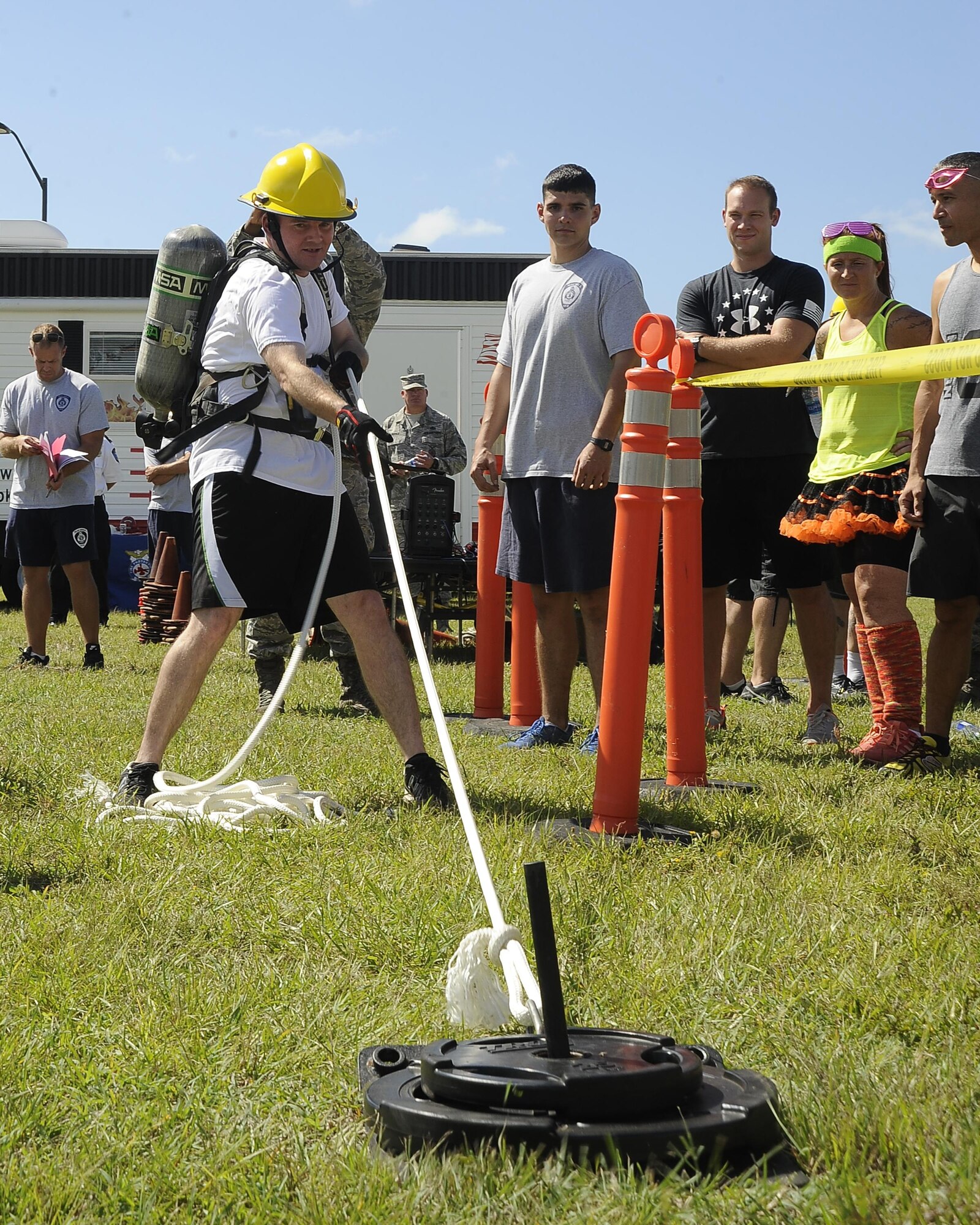 Master Sgt. Bradford Johnson, the first sergeant for the 6th Comptroller Squadron, pulls weights towards him during the MacDill’s Inaugural Firefighter’s Challenge at MacDill Air Force Base, Fla., Oct. 14, 2016. During the event, members of Team MacDill came out to participate and show support. (U.S. Air Force photo by Airman 1st Class Mariette Adams)