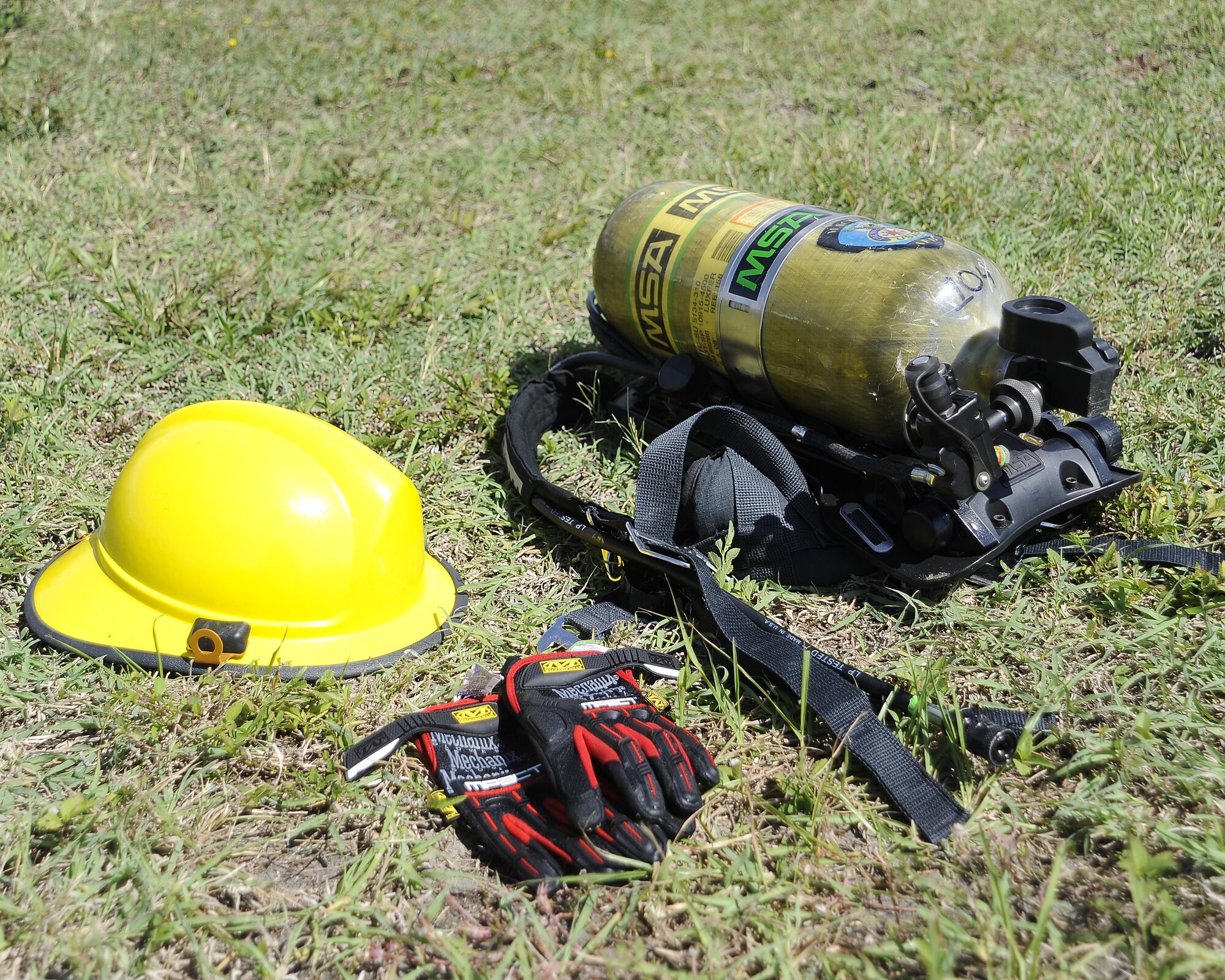 Equipment used during the MacDill’s Inaugural Firefighter’s Challenge lays out for display at MacDill Air Force Base, Fla., Oct. 14, 2016. During the event, participants were required to wear the equipment as they completed a series of stations. (U.S. Air Force photo by Airman 1st Class Mariette Adams)
