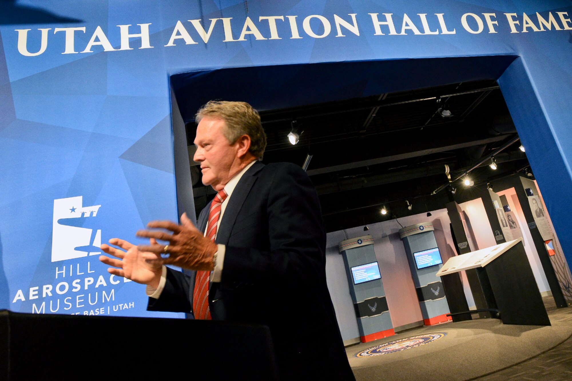 Utah State Senator Jerry W. Stevenson speaks during the opening ceremony for the newly-renovated Utah Aviation Hall of Fame, located at the Hill Aerospace Museum, Oct. 14. The Utah Aviation Hall of Fame, established in 1996 by Governor Mike Leavitt, recognizes individuals in the state of Utah who have distinguished themselves through heroic accomplishments as civil or military aviators, or by fostering exceptionally noteworthy advances in Utah’s aviation programs. (U.S. Air Force photo by Paul Holcomb)