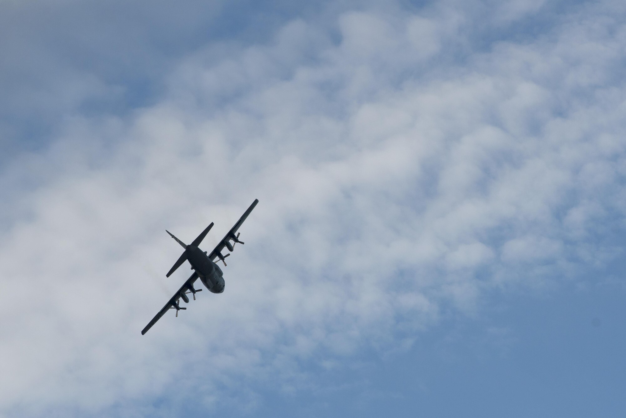 A C-130 Hercules from Joint Base Elmendorf-Richardson flies by during Red Flag - Alaska 17-1 Oct. 12, 2016. RF-A is a joint exercise focused on improving combat readiness of the U.S. military and international forces, which included the Republic of Korea Air Force and Royal New Zealand Air Force this iteration.