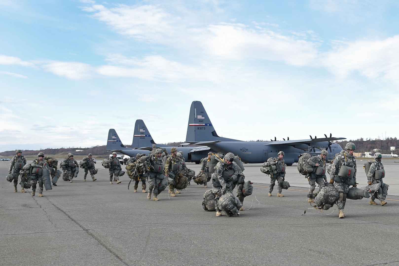 Paratroopers with the 4th Infantry Brigade Combat Team (Airborne), 25th Infantry Division, U.S. Army Alaska, prepare to board a Royal New Zealand Air Force C-130 Hercules during Red Flag Alaska 17-1 at Joint Base Elmendorf-Richardson, Alaska, Oct. 12, 2016. Red Flag-Alaska exercises are focused on improving the combat readiness of U.S. and international forces and providing training for units preparing for Air Expeditionary Force taskings. 