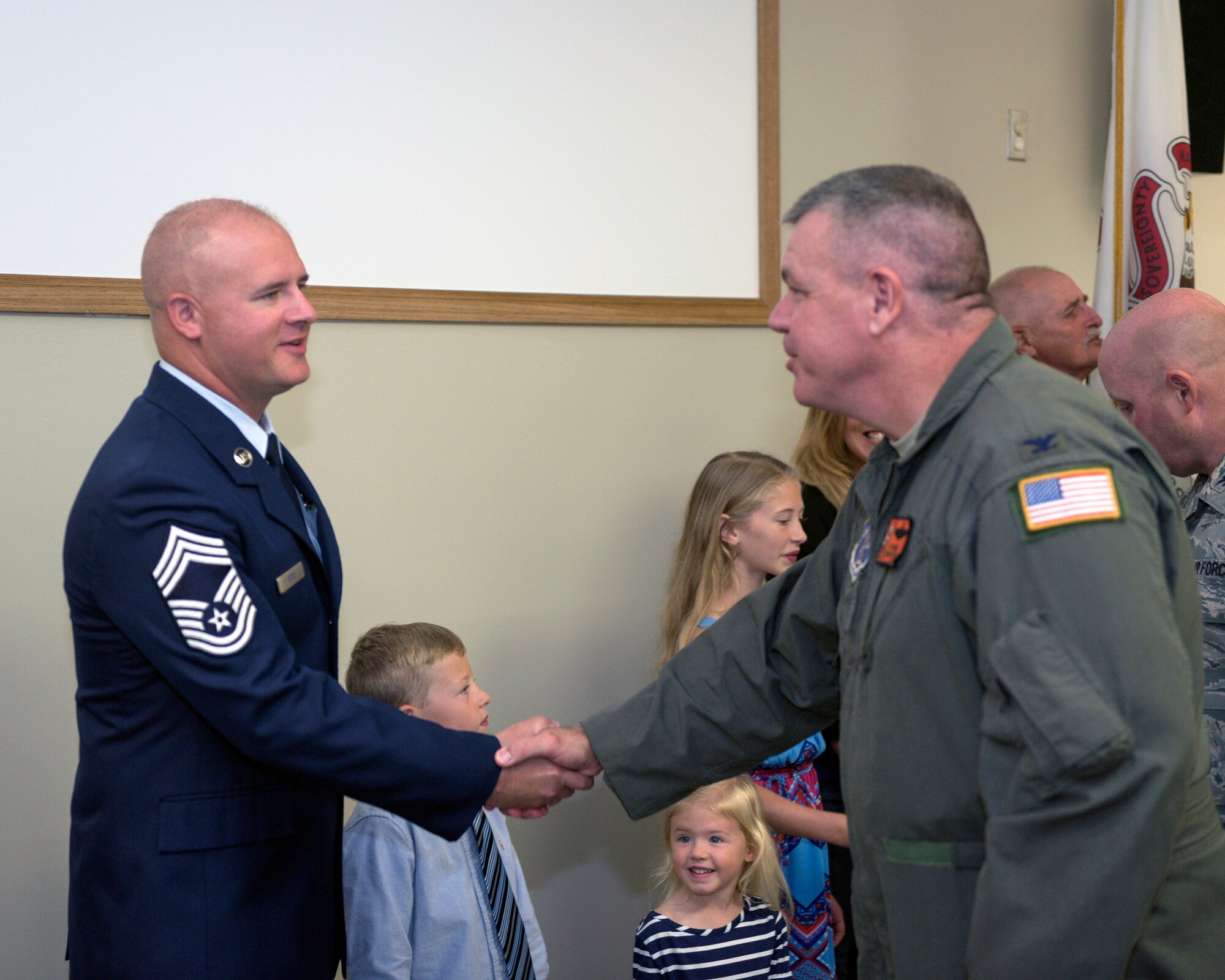 U.S. Air Force Chief Master Sgt. Clifford Otto III, left, the fire protection chief with the 182nd Civil Engineer Squadron, Illinois Air National Guard, receives congratulations from 182nd Airlift Wing commander Col. William Robertson during Otto’s promotion ceremony at the 182nd Airlift Wing in Peoria, Ill., Oct. 1, 2016. Otto has 18 years of active duty and ANG military service and has served with the 182nd since 2014. (U.S. Air National Guard photo by Tech. Sgt. Lealan Buehrer)