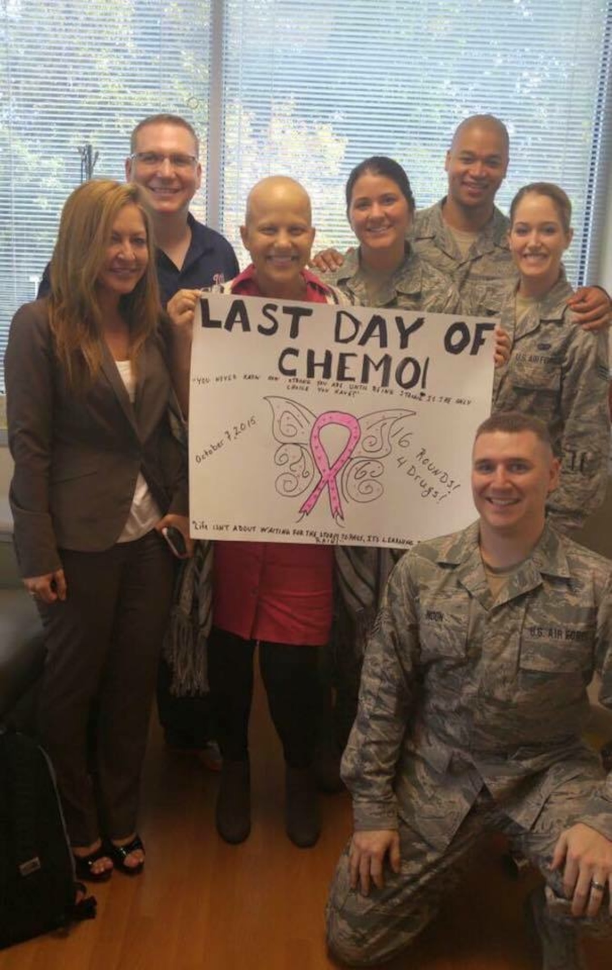 Tech. Sgt. Moira Howerton, 113th Communications Flight, D.C. Air National Guard, poses with co-workers on her last day of chemotherapy to treat stage 2, triple negative breast cancer. Howerton underwent 16 rounds of aggressive chemotherapy. (Photo courtesy of Tech. Sgt. Howerton)