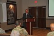 Brig. Gen. (Retired) Fernando Fernandez addresses Soldiers, civilians and Family members of the 1st Mission Support Command during a Hispanic Heritage event held at Ramos Hall on Fort Buchanan, October 15.