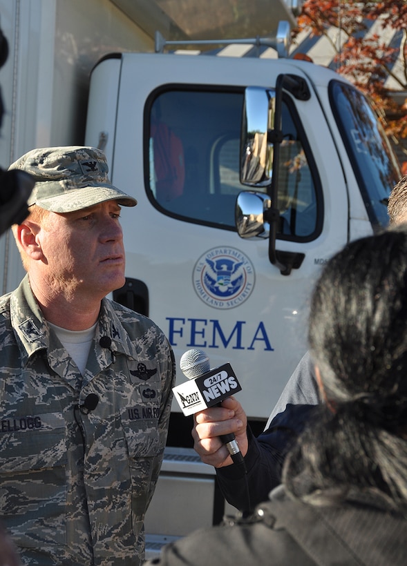 Col. Jim Kellogg, 94th Airlift Wing vice commander, speaks to several media outlets at a FEMA command post location on Dobbins Air Reserve Base, Georgia Oct. 12, 2016. Dobbins served as a staging location for the FEMA Urban Search and Rescue Blue Incident Support Team while they provided rapid federal response to local, federal, state and tribal agencies in support of Hurricane Matthew. (U.S. Air Force photo/James Branch)