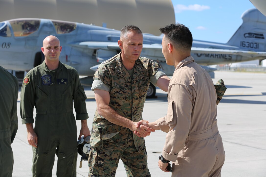 Brig. Gen. Matthew Glavy welcomes Marines home during a deployment homecoming aboard Marine Corps Air Station Cherry Point, N.C., Oct. 10, 2016. More than 20 air crew members with Marine Tactical Electronic Warfare Squadron 4 returned after a six-month deployment with the United States Central Command aboard Incirlik Air Base in Turkey. According to Lt. Col. Paul K. Johnson III, commanding officer for VMAQ-4, the Marines conducted electronic warfare and disrupted ISIS communications in Iraq and Syria in support of Operation Inherent Resolve. This deployment was the last that VMAQ-4 will participate in because the squadron is scheduled to be deactivated in the summer of 2017. Glavy is the commanding general for 2nd Marine Aircraft Wing. (U.S. Marine Corps photo by Lance Cpl. Mackenzie Gibson/Released)