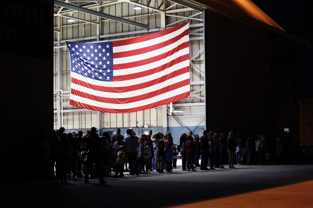 Families and friends eagerly wait for their Marines to arrive during a deployment homecoming aboard Marine Corps Air Station Cherry Point, N.C., Oct. 15, 2016. More than 120 Marines with Marine Tactical Electronic Warfare Squadron 4 returned after a six-month deployment with the United States Central Command aboard Incirlik Air Base in Turkey. According to Lt. Col. Paul K. Johnson III, commanding officer for VMAQ-4, the Marines conducted electronic warfare and disrupted ISIS communications in Iraq and Syria in support of Operation Inherent Resolve. This deployment was the last that VMAQ-4 will participate in because the squadron is scheduled to be deactivated in the summer of 2017. (U.S. Marine Corps photo by Lance Cpl. Mackenzie Gibson/Released)