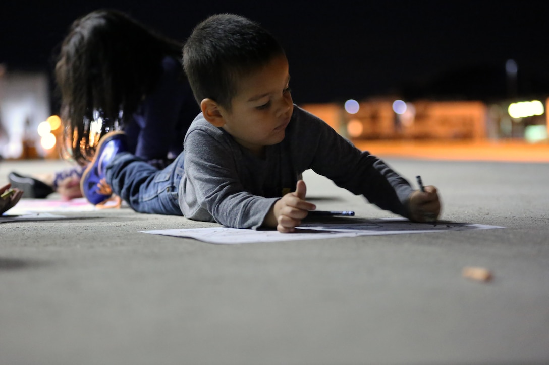 A child creates a “welcome home” poster for their loved one during a deployment homecoming aboard Marine Corps Air Station Cherry Point, N.C., Oct. 15, 2016. More than 120 Marines with Marine Tactical Electronic Warfare Squadron 4 returned after a six-month deployment with the United States Central Command aboard Incirlik Air Base in Turkey. According to Lt. Col. Paul K. Johnson III, commanding officer for VMAQ-4, the Marines conducted electronic warfare and disrupted ISIS communications in Iraq and Syria in support of Operation Inherent Resolve. This deployment was the last that VMAQ-4 will participate in because the squadron is scheduled to be deactivated in the summer of 2017. (U.S. Marine Corps photo by Lance Cpl. Mackenzie Gibson/Released)