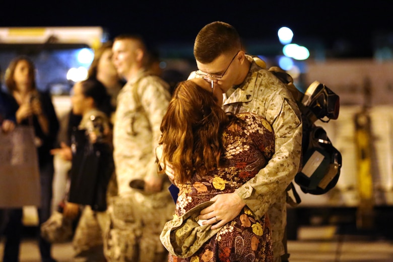 A Marine embraces his loved one during a deployment homecoming aboard Marine Corps Air Station Cherry Point, N.C., Oct. 15, 2016. More than 120 Marines with Marine Tactical Electronic Warfare Squadron 4 returned after a six-month deployment with the United States Central Command aboard Incirlik Air Base in Turkey. According to Lt. Col. Paul K. Johnson III, commanding officer for VMAQ-4, the Marines conducted electronic warfare and disrupted ISIS communications in Iraq and Syria in support of Operation Inherent Resolve. This deployment was the last that VMAQ-4 will participate in because the squadron is scheduled to be deactivated in the summer of 2017. (U.S. Marine Corps photo by Lance Cpl. Mackenzie Gibson/Released)