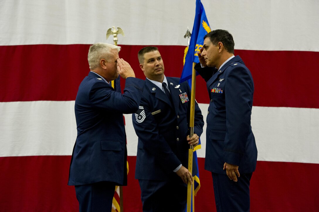 (Right) Lt. Col. Shawn Shrawny renders his first salute as 926th Aerospace Medicine Squadron commander to Col. Ross Anderson, 926th Wing commander, during a change of command ceremony at Nellis Air Force Base, Nevada, on Oct. 15. (U.S. Air Force photo/Senior Airman Brett Clashman)