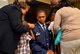 Lt. Col. Andre Wright, 94th Civil Engineer Squadron commander, is pinned by his family with his new rank during his ceremony of promotion at Dobbins Air Reserve Base on October 15, 2016. Wright spoke highly of his support system during the ceremony. (U.S. Air Force photo by Senior Airman Lauren Douglas) 