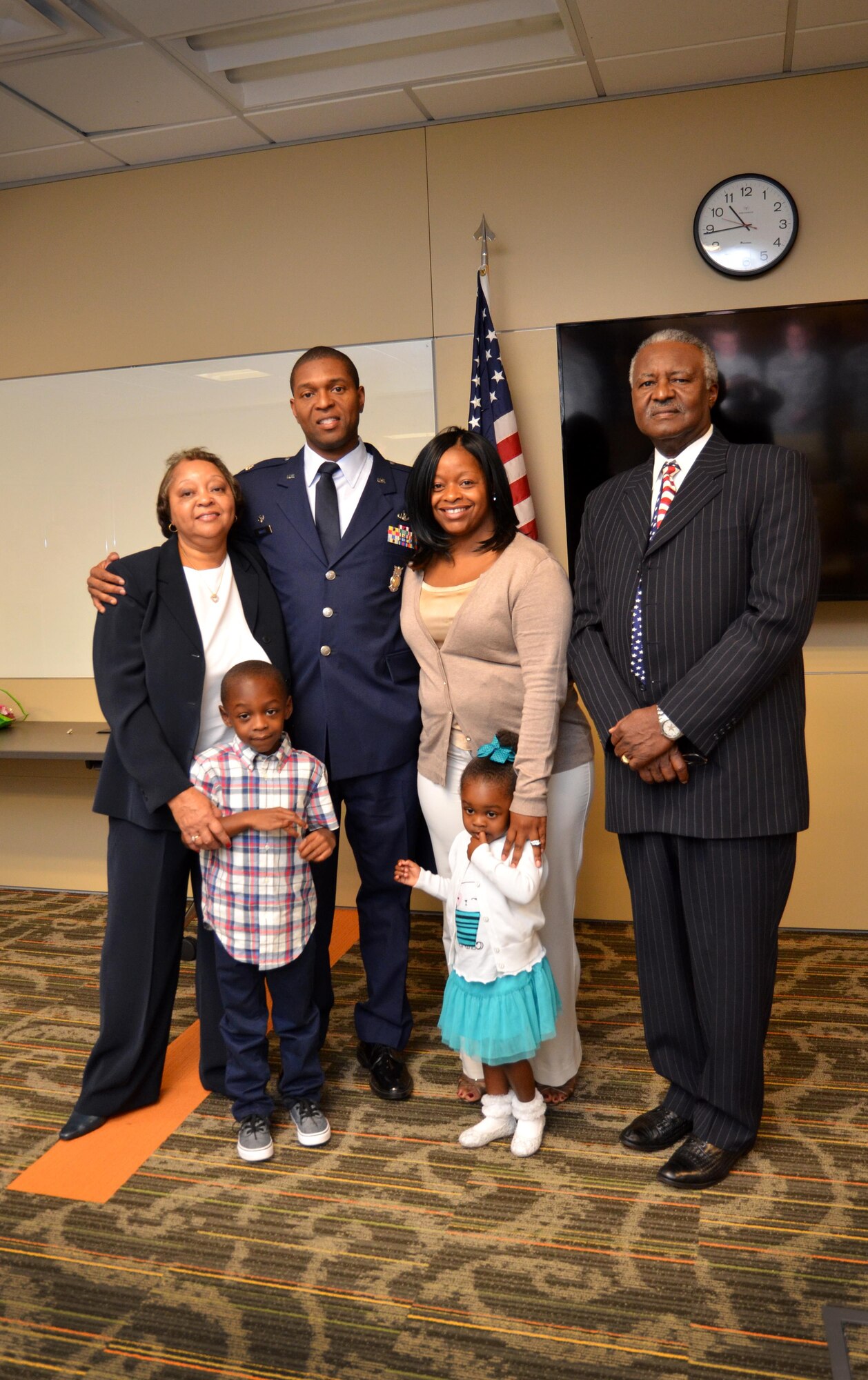 Newly promoted Lt. Col. Andre Wright, 94th Civil Engineer Squadron, stands with his family after his ceremony of promotion at Dobbins Air Reserve Base on October 15, 2016. Wright’s father, a retired Air Force chief, delivered the invocation and his family pinned on his new rank. (U.S. Air Force photo by Senior Airman Lauren Douglas)