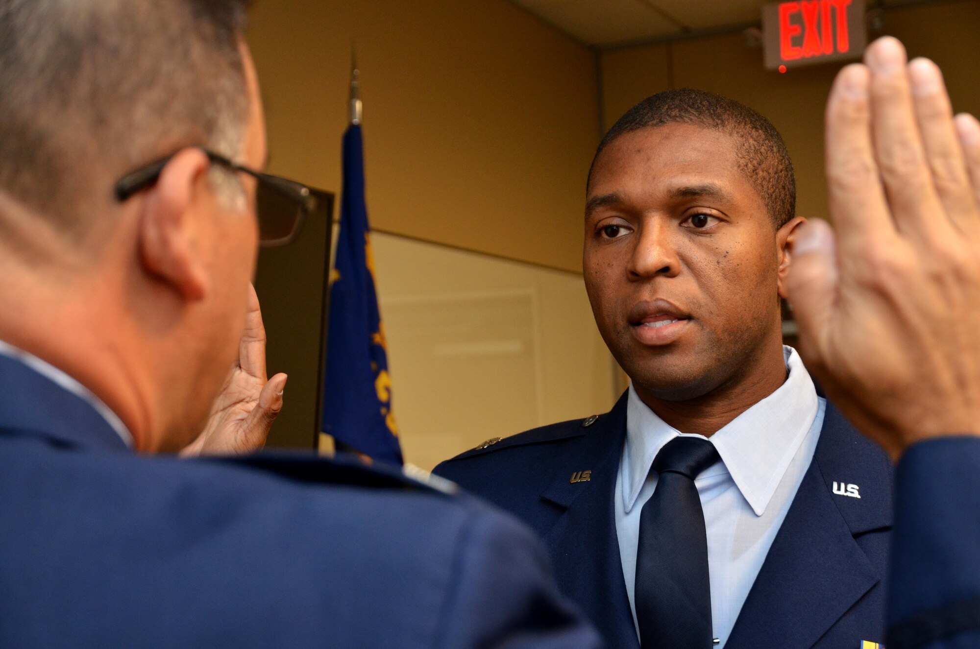Newly promoted Lt. Col. Andre Wright, 94th Civil Engineer Squadron, is sworn in during his ceremony of promotion at Dobbins Air Reserve Base on October 15, 2016. Col. Marty Hughes, 94th Mission Support Group commander, was the presiding officer. (U.S. Air Force photo by Senior Airman Lauren Douglas)
