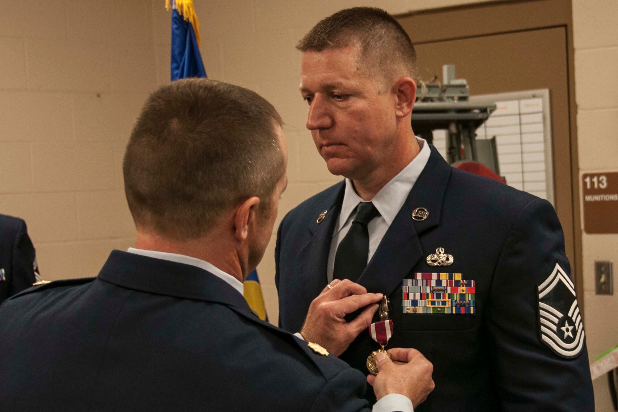 U.S. Air Force Maj. Michael Maise, 307th Maintenance Group director of staff, pins the Air Force Commendation Medal on Senior Master Sgt. Robert Carpenter at Barksdale Air Force Base, La., Oct. 15, 2016.   Carpenter retired after a 22-year military career that saw him serve in multiple hotspots around the globe. (U.S. Air Force photo by Tech. Sgt. Ted Daigle/released)