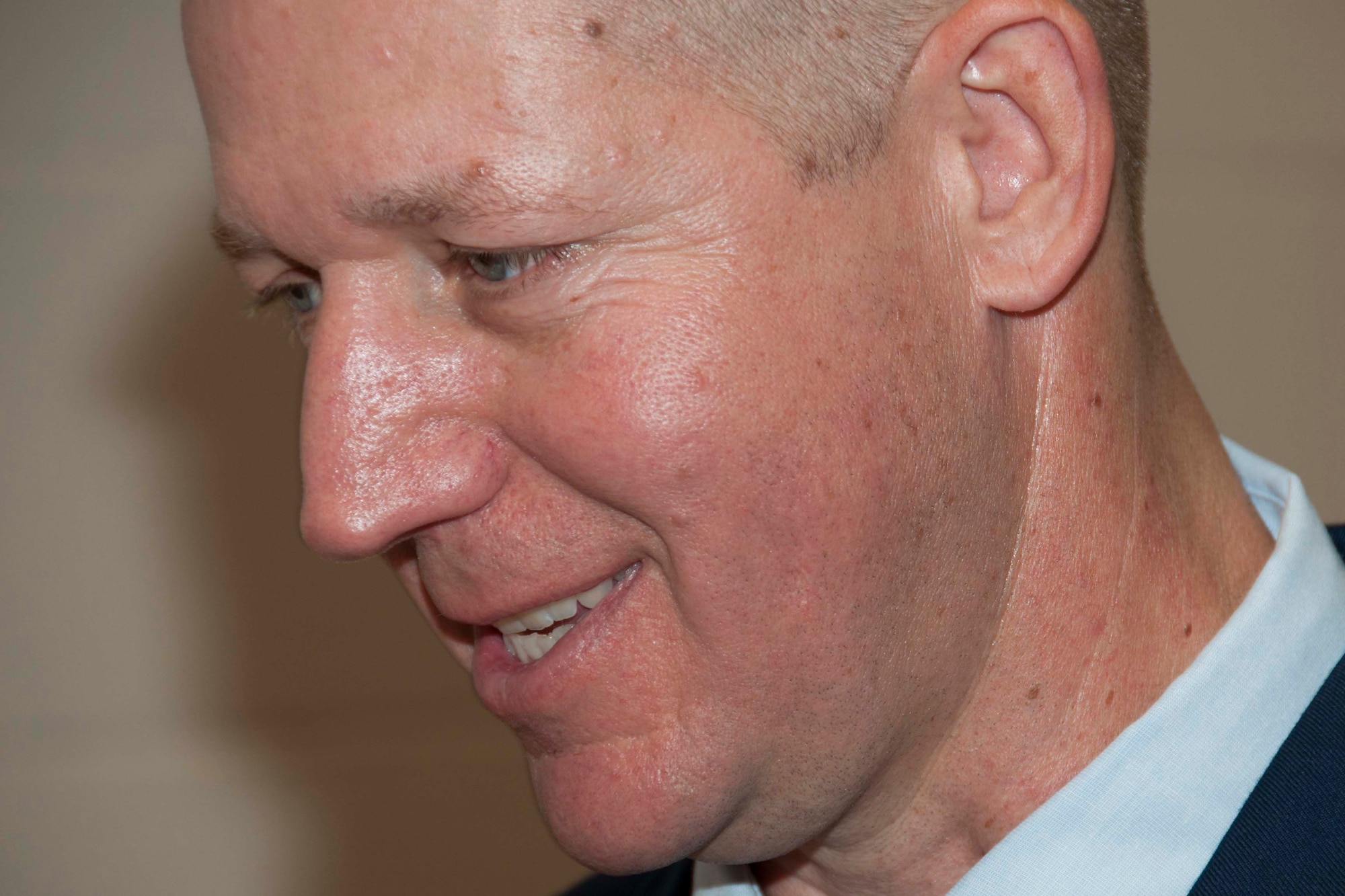 U.S. Air Force Senior Master Sgt. Robert Carpenter smiles at a joke told during his retirment ceremony at Barksdale Air Force Base, La., Oct. 15, 2016.   He retired after 22 years of service in the military. (U.S. Air Force photo by Tech. Sgt. Ted Daigle/released)
