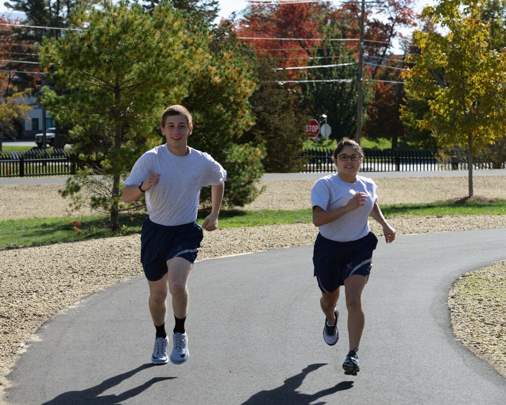 U.S. Air Force Airman 1st Class Matthew Caporale and Airman 1st Class Arielle Longhi take a run on the new running track, Pease Air National Guard Base, N.H., Oct. 15, 2016. The purpose of the new track is to give Airmen a safe, dedicated space for running in preparation for and execution of fitness tests, as well as to enhance personal physical fitness.  (U.S. Air National Guard photo by Staff Sgt. Curtis J. Lenz)