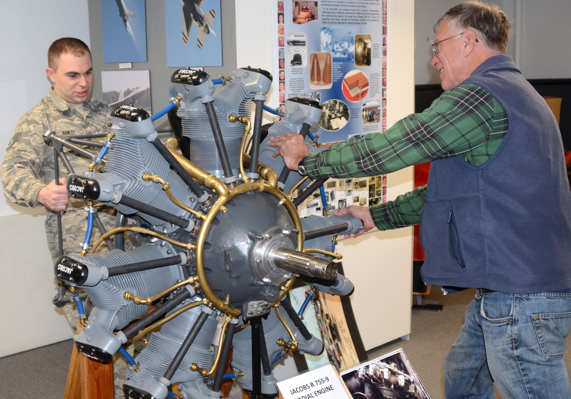 Staff Sgt. Dave Ranlet, 175th Logistic Readiness Squadron, and Ted Cooper, director of operations for the Glenn L. Martin Maryland Aviation Museum in Middle River, Md., push a display engine into position in the museum.  Ranlet volunteers his off- duty time restoring planes displayed in the museum.  (U.S. Air National Guard photo by Tech. Sgt. David Speicher/RELEASED)