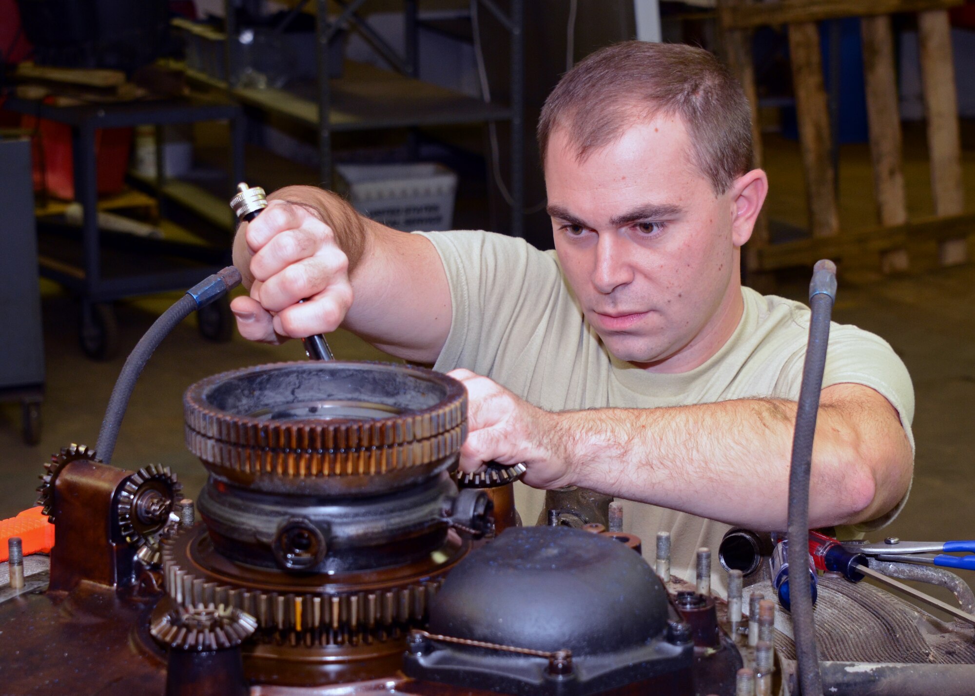 Staff Sgt. Dave Ranlet, 175th Logistic Readiness Squadron, works on an R-2800 engine previously used in World War II fighters like the P-47 Thunderbolt II and F-4U Corsair on November 15th. When the engine is fully restored, it will be on display in the Glenn L. Martin Maryland Aviation Museum in Baltimore. Ranlet volunteers his time rebuilding engines for the museum. (U.S. Air National Guard photo by Tech. Sgt. David Speicher/RELEASED)