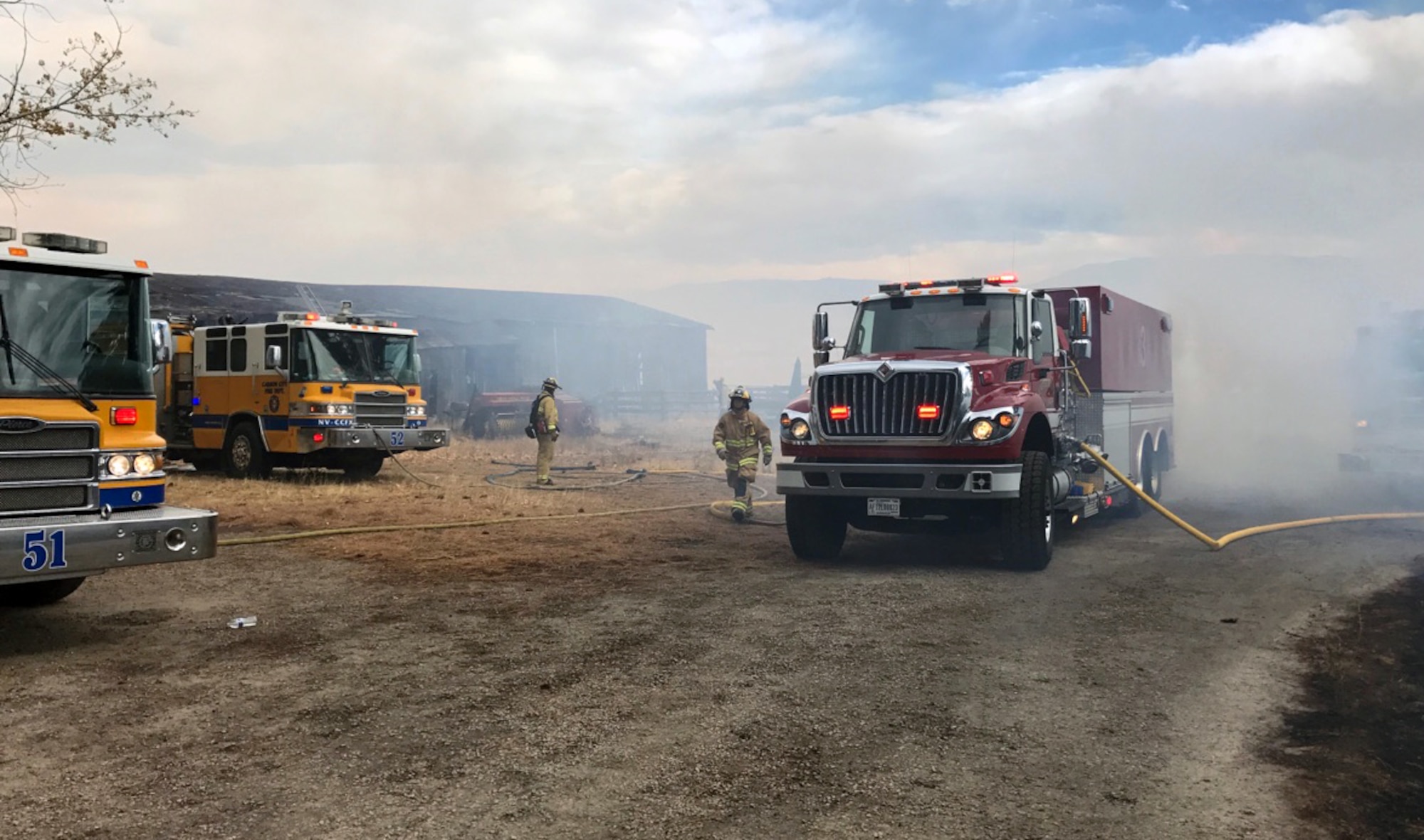 A Nevada Air National Guard fire tender re-supplies fire engines from multiple governmental agencies during the Little Valley Fire that burned 22 homes Friday. Photo courtesy Nevada Air National Guard Fire Emergency Services
