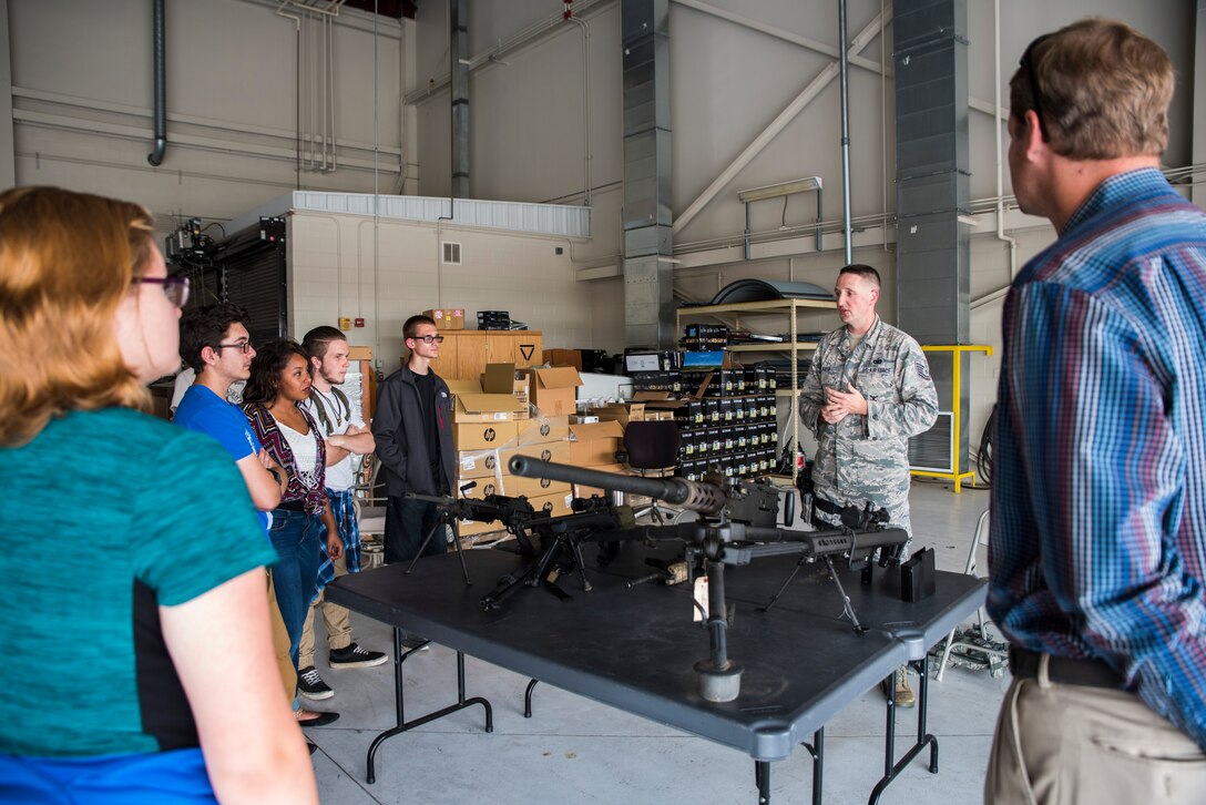 Tech. Sgt. Frank Koeth, 188th Security Forces training instructor, tells students from the Future School of Fort Smith about the security forces mission Oct. 7, 2016, during their visit at Ebbing Air National Guard Base, Fort Smith, Ark. The Future School of Fort Smith’s mission is to complement current Fort Smith high school programming through an innovative, school-wide culture of real-world preparation by emphasizing the potential for each student to identify interests, cultivate in-demand skills and graduate ready for the world. (U.S. Air National Guard photo by Senior Airman Cody Martin)