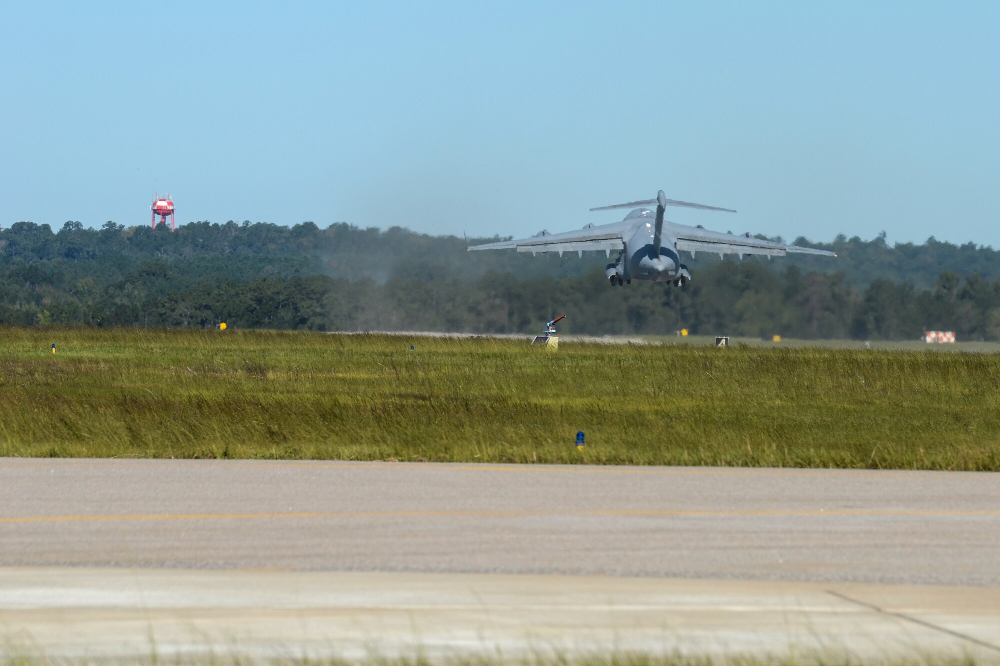 A U.S. C-17 Globemaster III, a large military transport aircraft, belonging to the 21st Airlift Squadron from Travis AFB, Calif., departs from McEntire Joint National Guard Base, S.C., Oct. 7, 2016. Equipment from the South Carolina Air National Guard's 245th Air Traffic Control Squadron was loaded onto the aircraft in preparation for a deployment in support of Operation INHERENT RESOLVE. (U.S. Air National Guard photo by Airman 1st Class Megan Floyd)