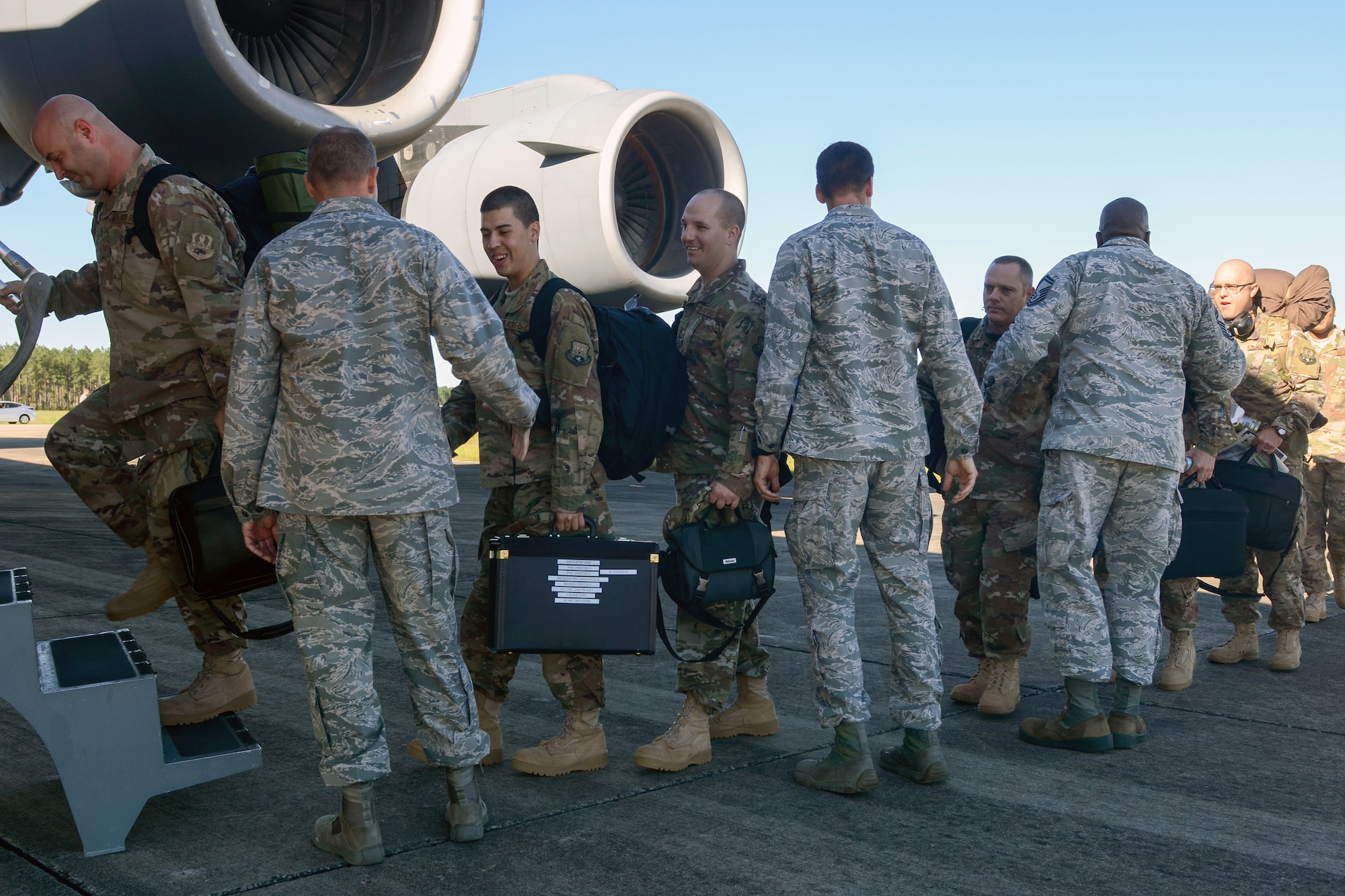 U.S. Air Force personnel from the South Carolina Air National Guard's 245th Air Traffic Control Squadron depart from McEntire Joint National Guard Base, S.C. for a deployment to Iraq in support of Operation INHERENT RESOLVE, Oct. 8, 2016. Approximately a dozen air traffic control and support personnel boarded a C-17 Globemaster III, large military transport aircraft, belonging to the 21st Airlift Squadron from Travis AFB, Calif. (U.S. Air National Guard photo by Airman 1st Class Megan Floyd)