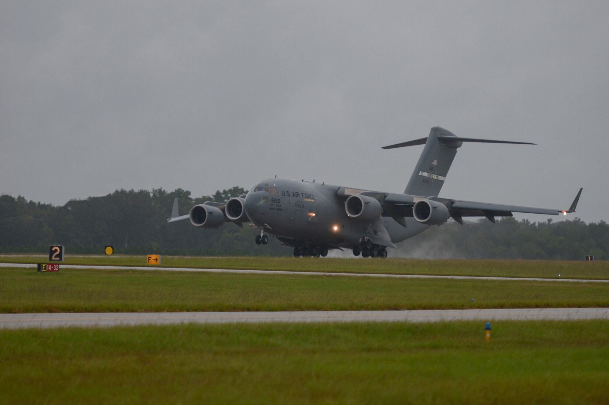 A U.S. C-17 Globemaster III, a large military transport aircraft, belonging to the 21st Airlift Squadron from Travis AFB, Calif., lands at McEntire Joint National Guard Base, S.C., Oct. 7, 2016. Equipment from the South Carolina Air National Guard's 245th Air Traffic Control Squadron was loaded onto the aircraft in preparation for a deployment in support of Operation INHERENT RESOLVE. (U.S. Air National Guard photo by Airman 1st Class Megan Floyd)
