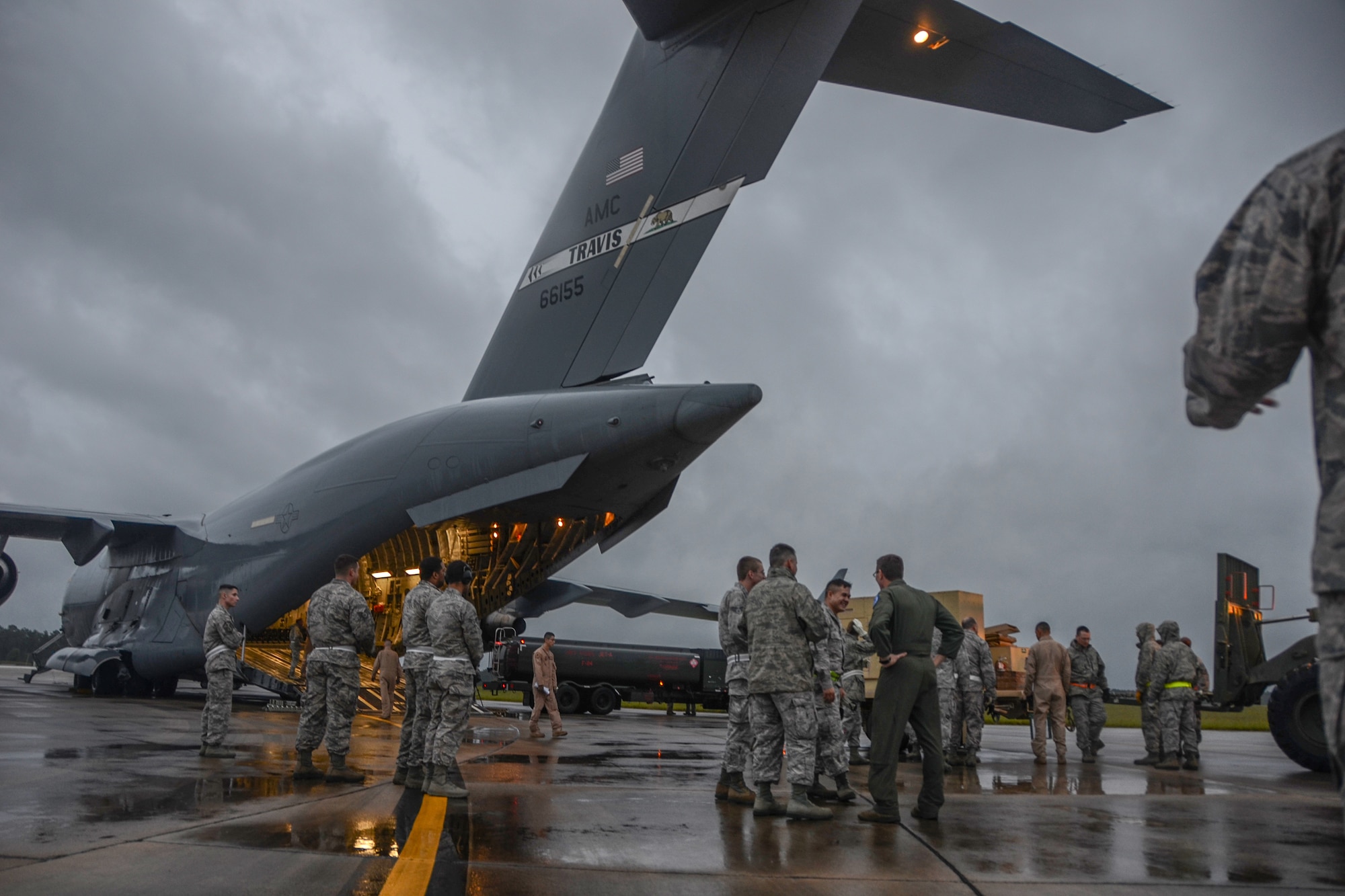A U.S. C-17 Globemaster III, a large military transport aircraft, belonging to the 21st Airlift Squadron from Travis AFB, Calif., is being loaded at McEntire Joint National Guard Base, S.C., Oct. 7, 2016. Equipment from the South Carolina Air National Guard's 245th Air Traffic Control Squadron was loaded onto the aircraft in preparation for a deployment in support of Operation INHERENT RESOLVE. (U.S. Air National Guard photo by Airman 1st Class Megan Floyd)