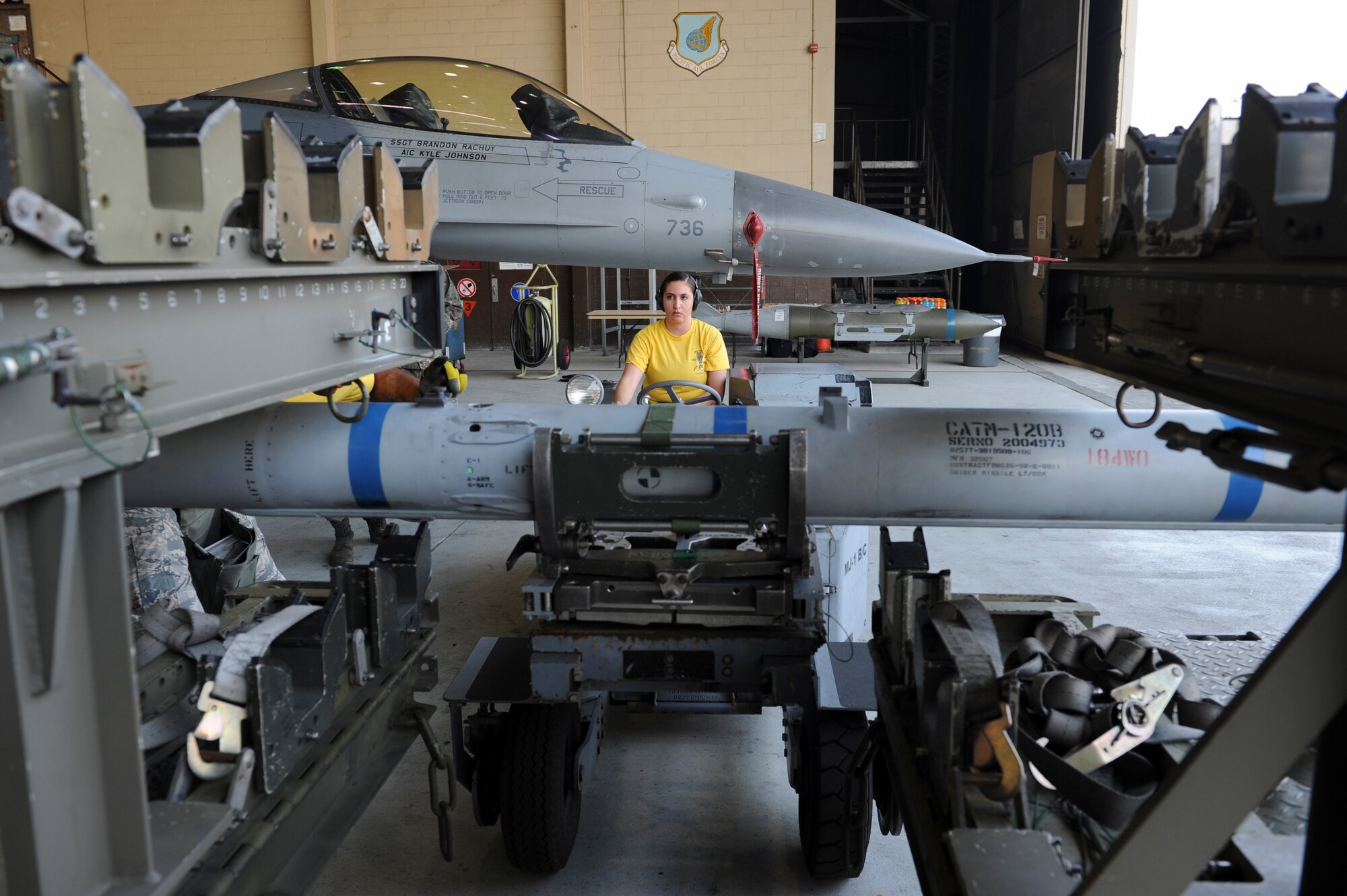 Senior Airman Isamar Perez, 80th Aircraft Maintenance Unit load crew member, moves an inert munition during the Weapons Load Crew of the Quarter competition at Kunsan Air Base, Republic of Korea, Oct. 14, 2016. The event consisted of members from the 38th Logistics Squadron, 80th AMU and 35th AMU competing in a timed munitions load. This was the first year the ROK Air Force and U.S. Air Force participated in the event together. (U.S. Air Force photo by Senior Airman Michael Hunsaker/Released)