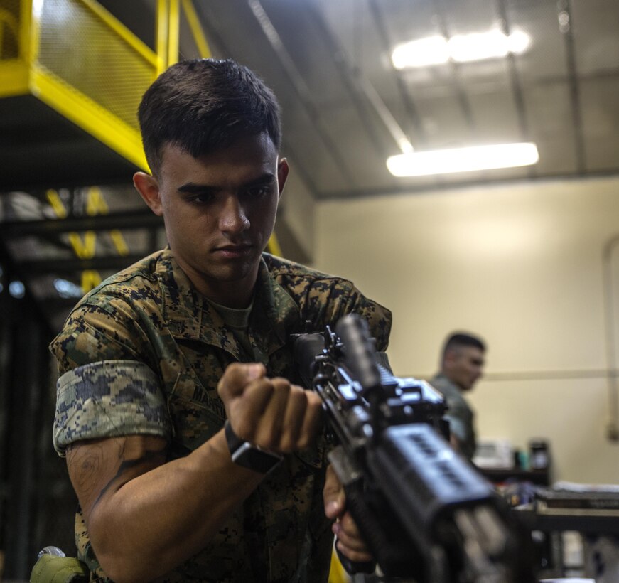 Lance Cpl. Jordan Martinez conducts a functions check on a M240B medium machine gun at III Marine Expeditionary Force Headquarters Group armory, on Camp Hansen, Okinawa, Japan, October 12, 2016. Martinez repairs, inspects and maintains all weapons to ensure combat readiness. A big part of the Marine Corps is weapons maintenance and accountability. Martinez, from Pepperell, Massachusetts, is a small arms repair technician for III MHG, III Marine Expeditionary Force.  (U.S. Marine Corps photo by Cpl. Jessica Etheridge / Released)