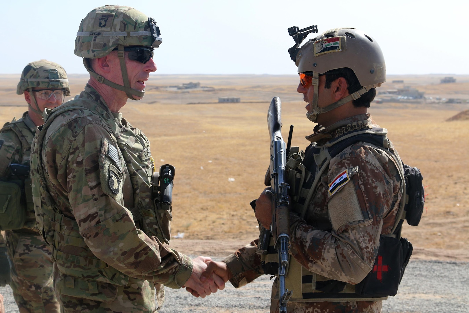 U.S. Army Maj. Gen. Gary J. Volesky, left, commander, Combined Joint Forces Land Component Command – Operation Inherent Resolve, visits with an Iraqi soldier at a tactical assembly area in  northern Iraq, Iraq, prior to the start of the Mosul offensive, Oct. 10, 2016. The TAAs are where ISF assembled prior to making their push toward Mosul. A Coalition of regional and international nations have joined together to defeat the Islamic State of Iraq and the Levant and the threat they pose to Iraq, Syria, the region and the wider international community. (U.S. Army photo by Sgt. 1st Class R.W. Lemmons IV)