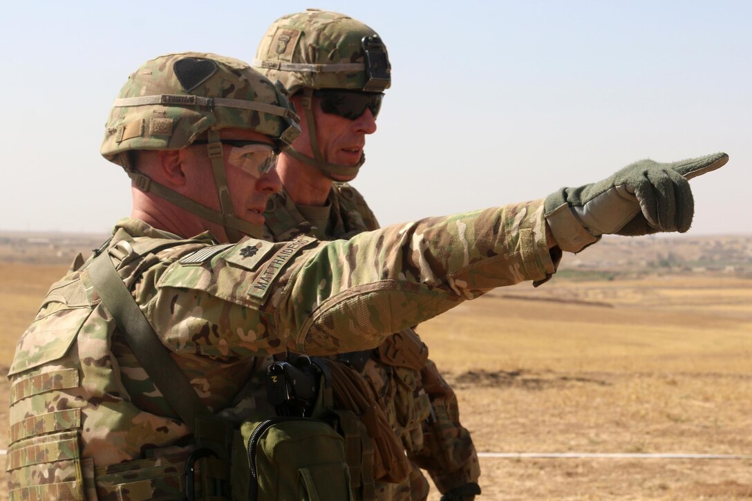 U.S. Army Lt. Col. Ed Matthaidess, commander, left, Task Force Falcon, outlines areas of an Iraqi security forces tactical assembly area to U.S. Army Maj. Gen. Gary J. Volesky, commander, Combined Joint Forces Land Component Command – Operation Inherent Resolve, in northern Iraq, prior to the start of the Mosul offensive, Oct. 10, 2016. The TAAs are where ISF assembled prior to moving toward Mosul. A Coalition of regional and international nations have joined together to defeat the Islamic State or Iraq and the Levant and the threat they pose to Iraq, Syria, the region and the wider international community. (U.S. Army photo by Sgt. 1st Class R.W. Lemmons IV)