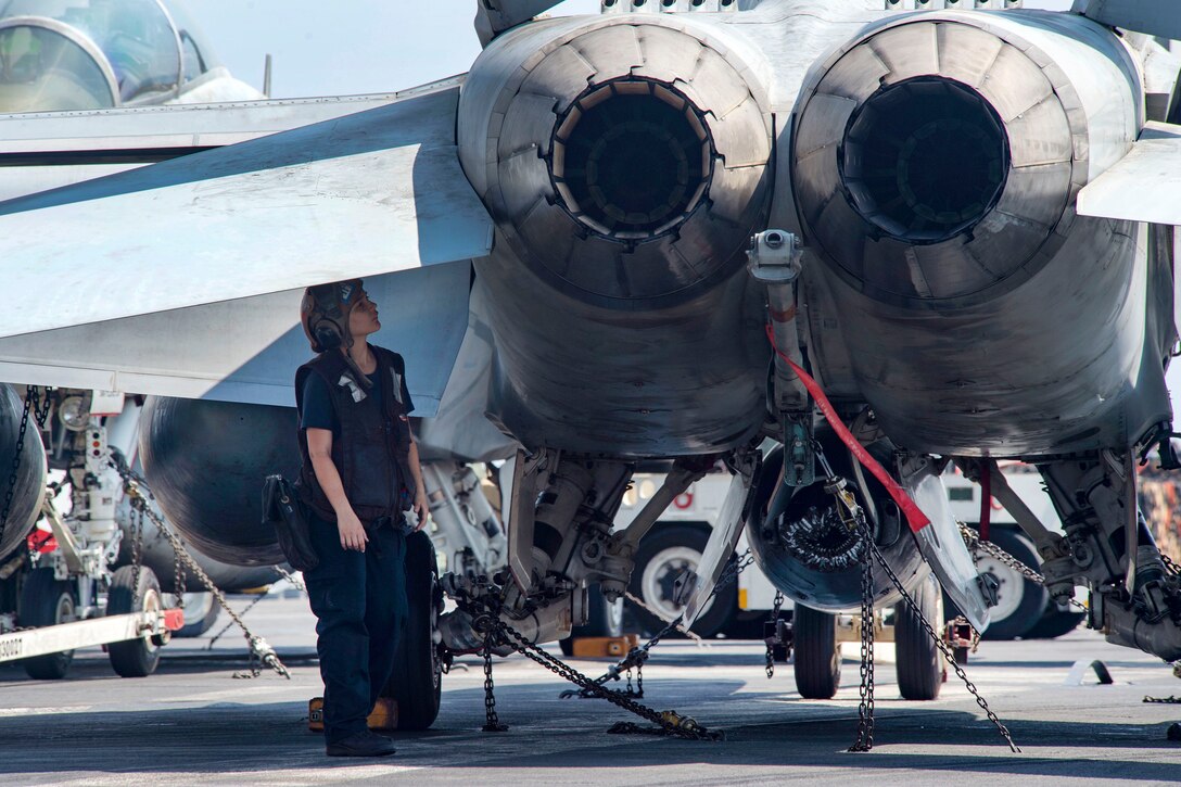 Navy Seaman Laurymar Nieves conducts a fastener integrity check on an F/A-18F Super Hornet assigned to Strike Fighter Squadron 32 on the flight deck of the aircraft carrier USS Dwight D. Eisenhower in the Persian Gulf, Oct. 14, 2016. Nieves is an aviation machinist's mate. Navy photo by Petty Officer 3rd Class Robert J. Baldock