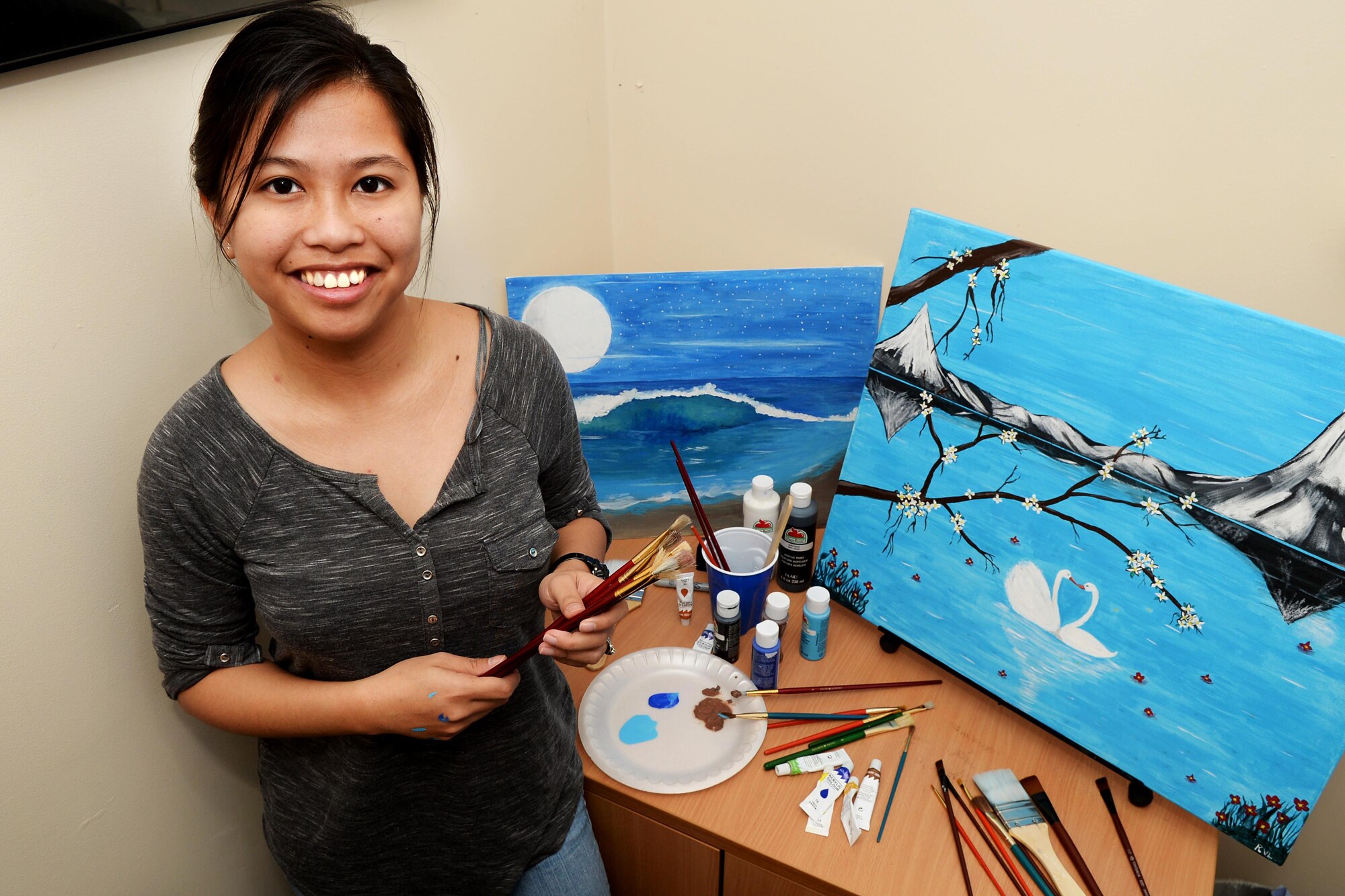 U.S. Air Force Senior Airman Regine Labarda, 100th Comptroller Squadron relocation technician, poses for a photograph Oct. 17, 2016, in England. Labarda uses her love of painting to make the most of her down time. (U.S. Air Force photo by Airman 1st Class Tenley Long)