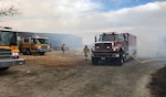 A Nevada Air National Guard fire tender re-supplies fire engines from multiple governmental agencies during the Little Valley Fire that burned 22 homes Friday.