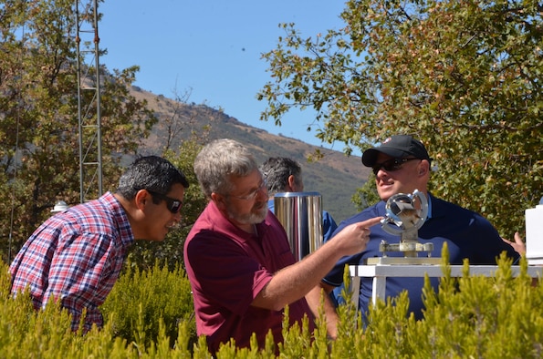 David Merker, Senior Executive Service Director of the U.S. National Data Center (center), points out the inner workings of a solar intensity measurement tool that’s used to gauge the intensity of the sun at any given time to Jorge Román-Nieves, a geophysicist from the Air Force Technical Applications Center Sept. 19, 2016, as AFTAC’s chief of International Affairs Robert McLaughlin listens in.  The trio traveled to Spain to meet with seismic experts from the Instituto Geográfico Nacional, a multi-faceted agency in Madrid responsible for many aspects of research and development.  (U.S. Air Force photo by Susan A. Romano)