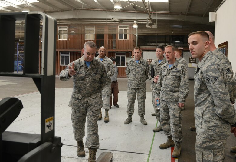 U.S. Air Force Tech. Sgt. Timothy Brady, 728th Air Mobility Squadron aircraft service section chief, explains the palletizing process to U.S. Air Force Col. Thomas Cooper, 521st Air Mobility Operations Wing commander from Ramstein Air Force Base, Germany, Oct. 14, 2016, at Incirlik Air Base, Turkey. Cooper visited Incilik to better understand 728th AMS operations. 